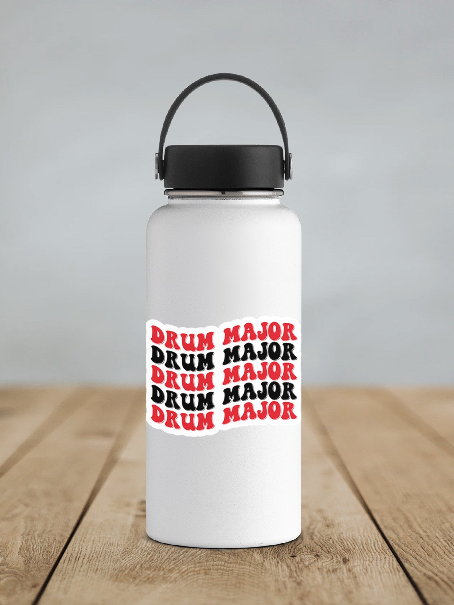 a white water bottle sitting on top of a wooden table