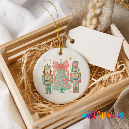 A wooden crate containing a white ceramic ornament with a nutcracker and a Christmas tree design.