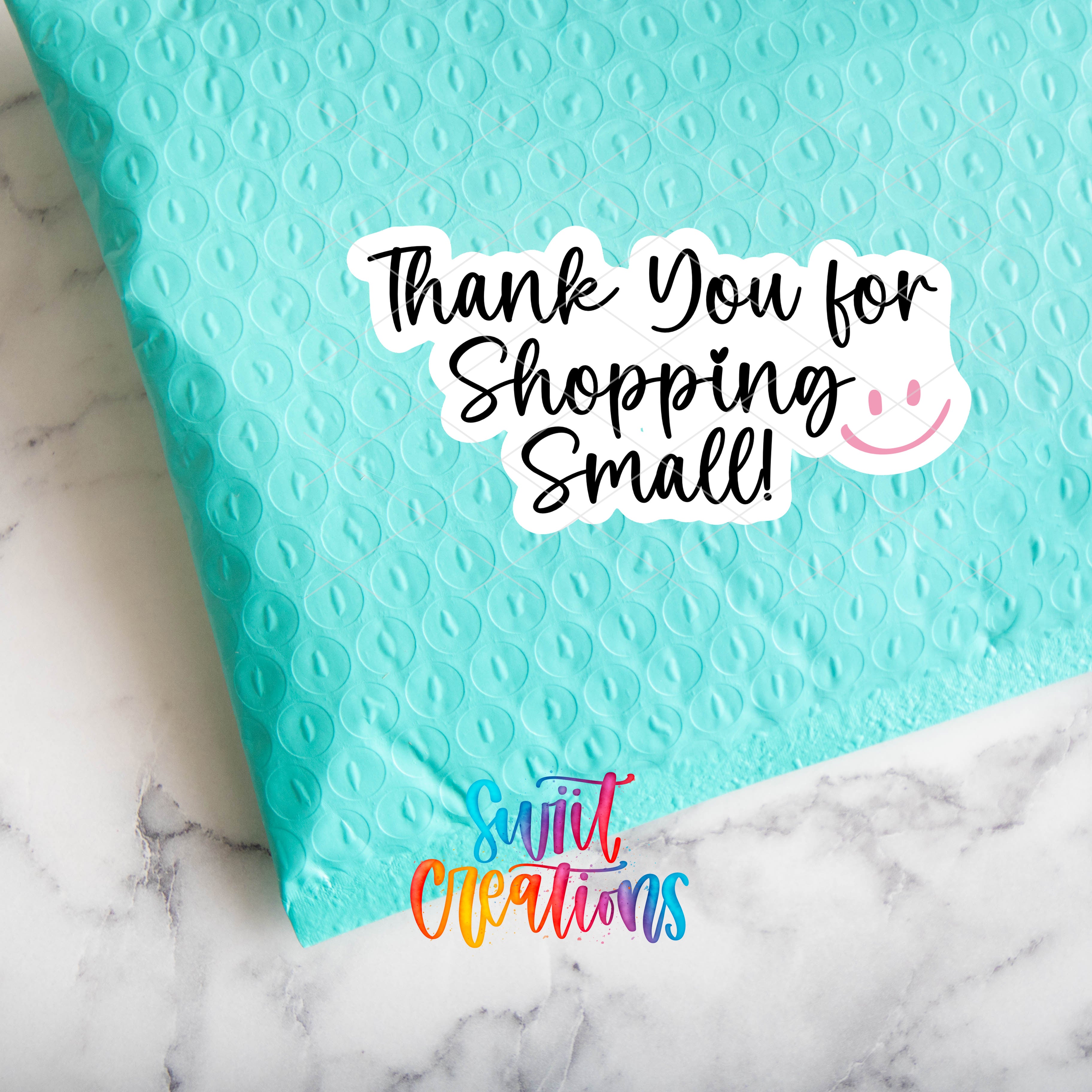 a thank you for shopping small bag on a marble surface