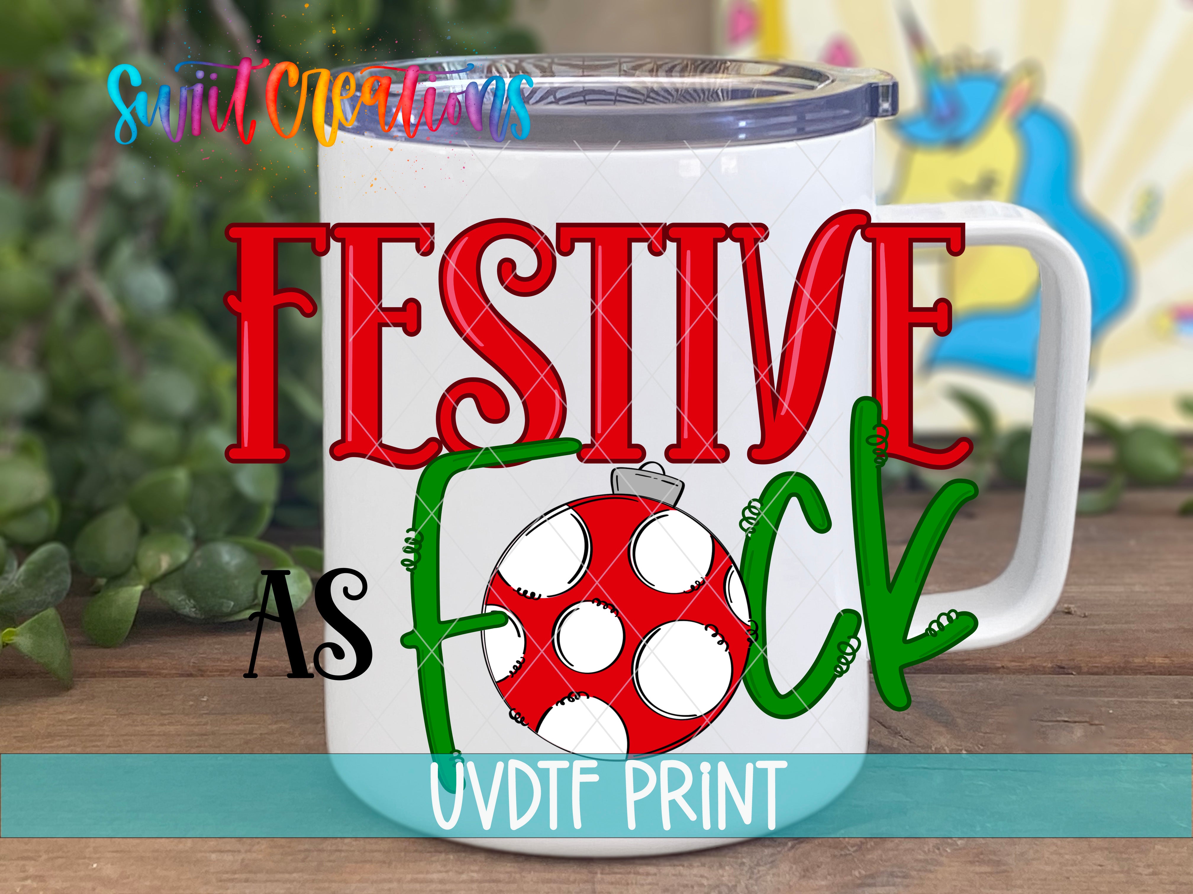 A white mug with a red and green design featuring a red and white polka dot pattern, along with the text "FESTIVE AS FOCK" and "UVDDF PRINT" printed on it.