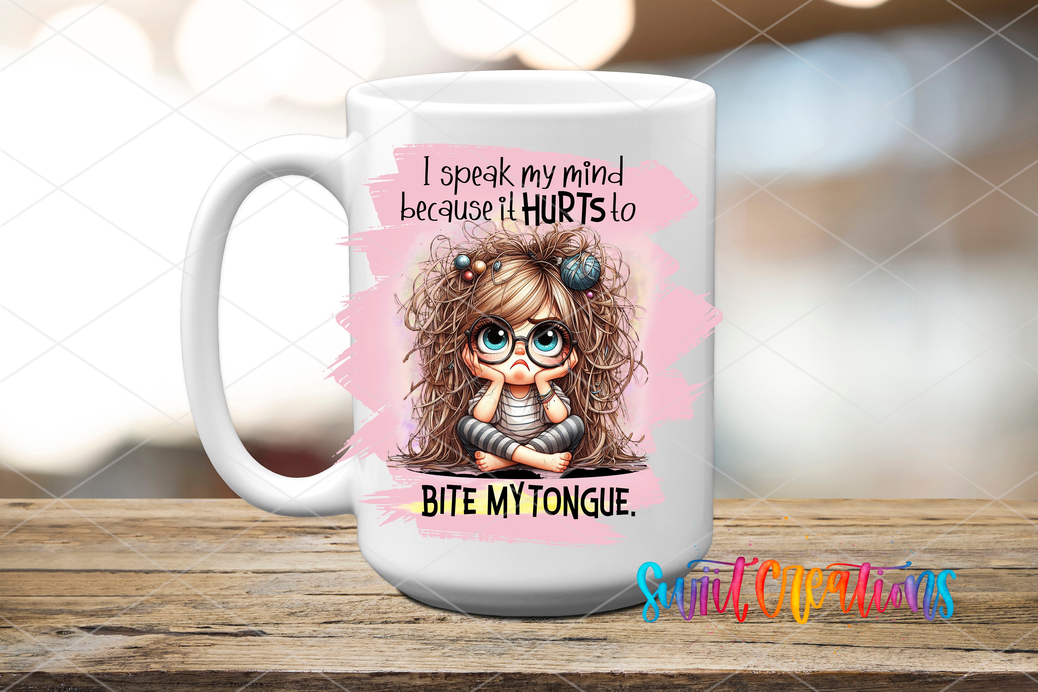 A white mug with a cartoon image of a young girl with messy hair and a thoughtful expression, along with text that reads "I speak my mind because it Hurts to Bite My Tongue".