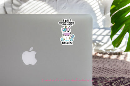 a laptop with a sticker of a unicorn on it