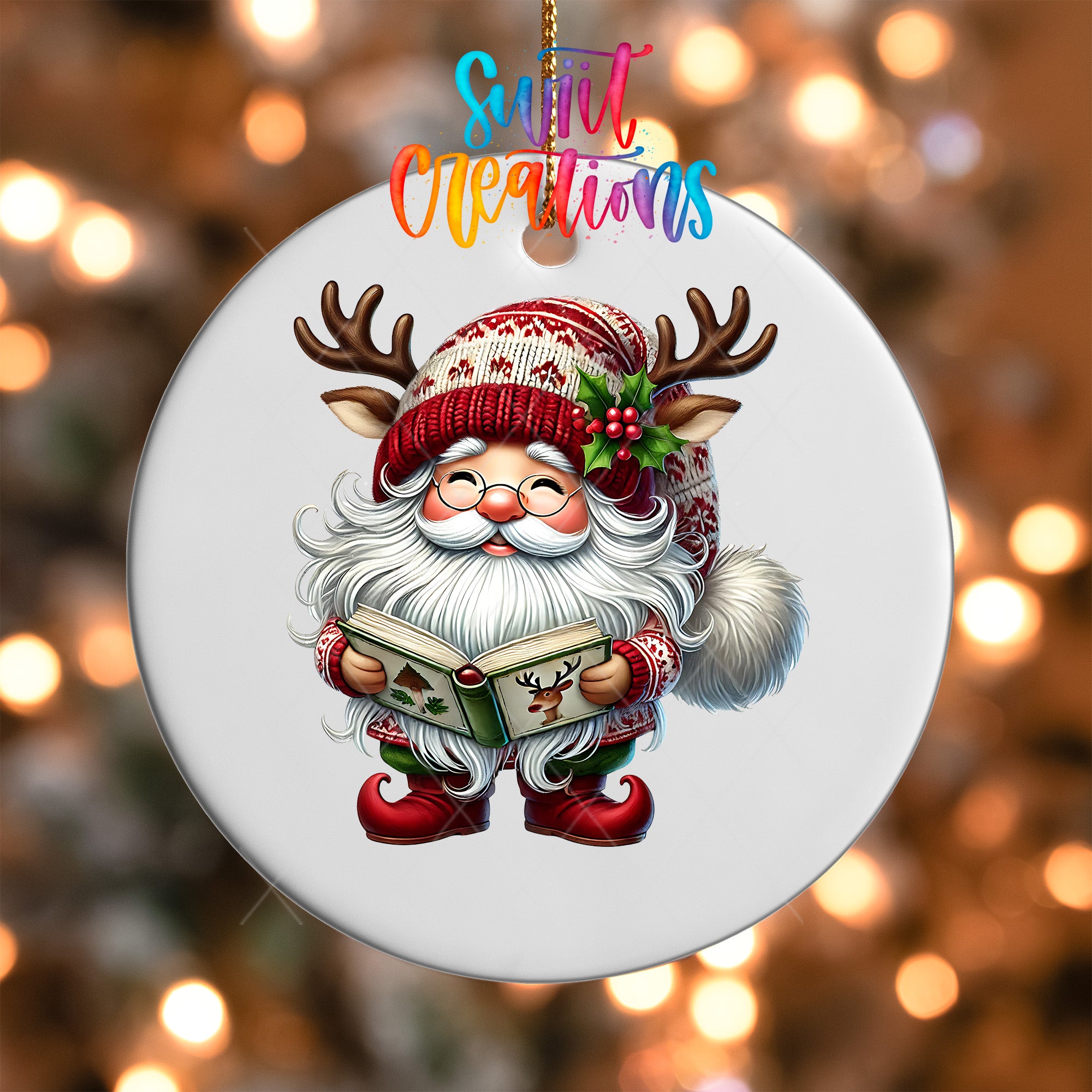 A white ornament featuring a cartoon Santa Claus holding a book and wearing a red and white hat with antlers, with the text "Sweet Creations" above the image.