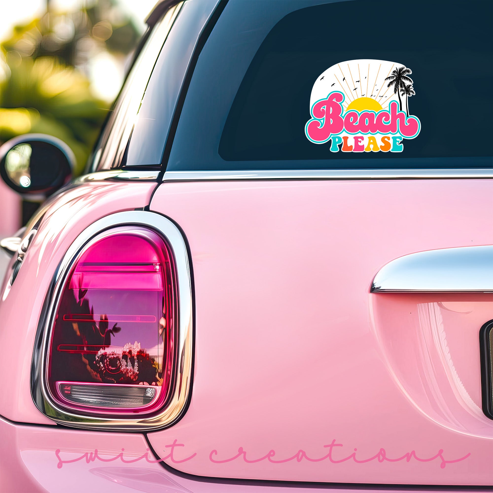 a pink car with a sticker on the back of it