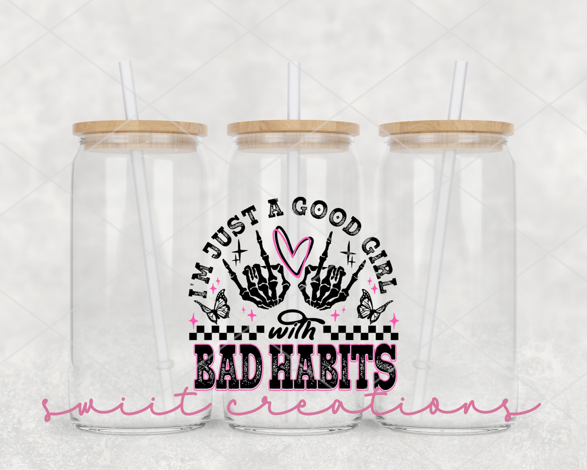 two plastic cups with straws on top of them