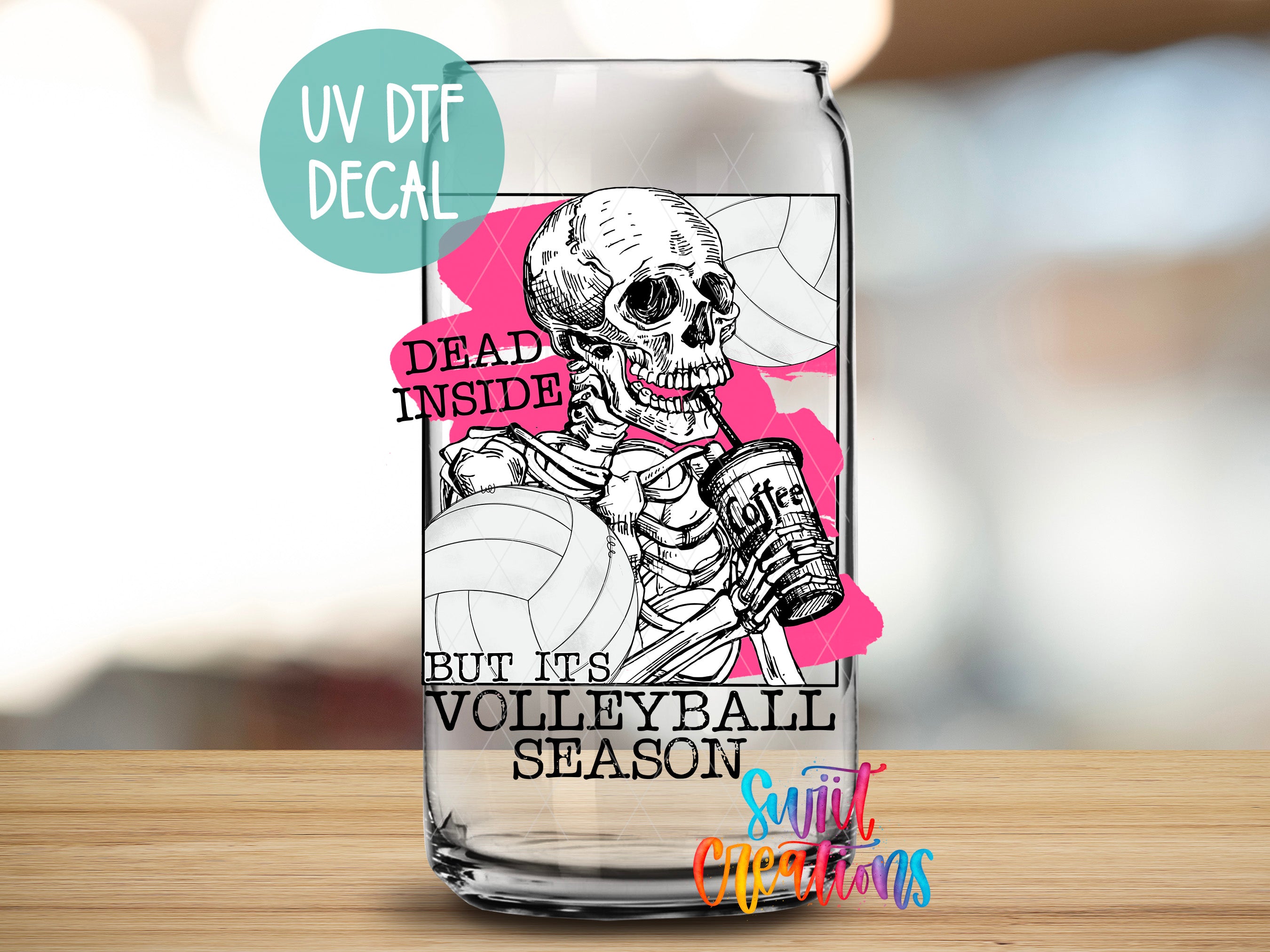 a glass with a skeleton holding a volleyball ball