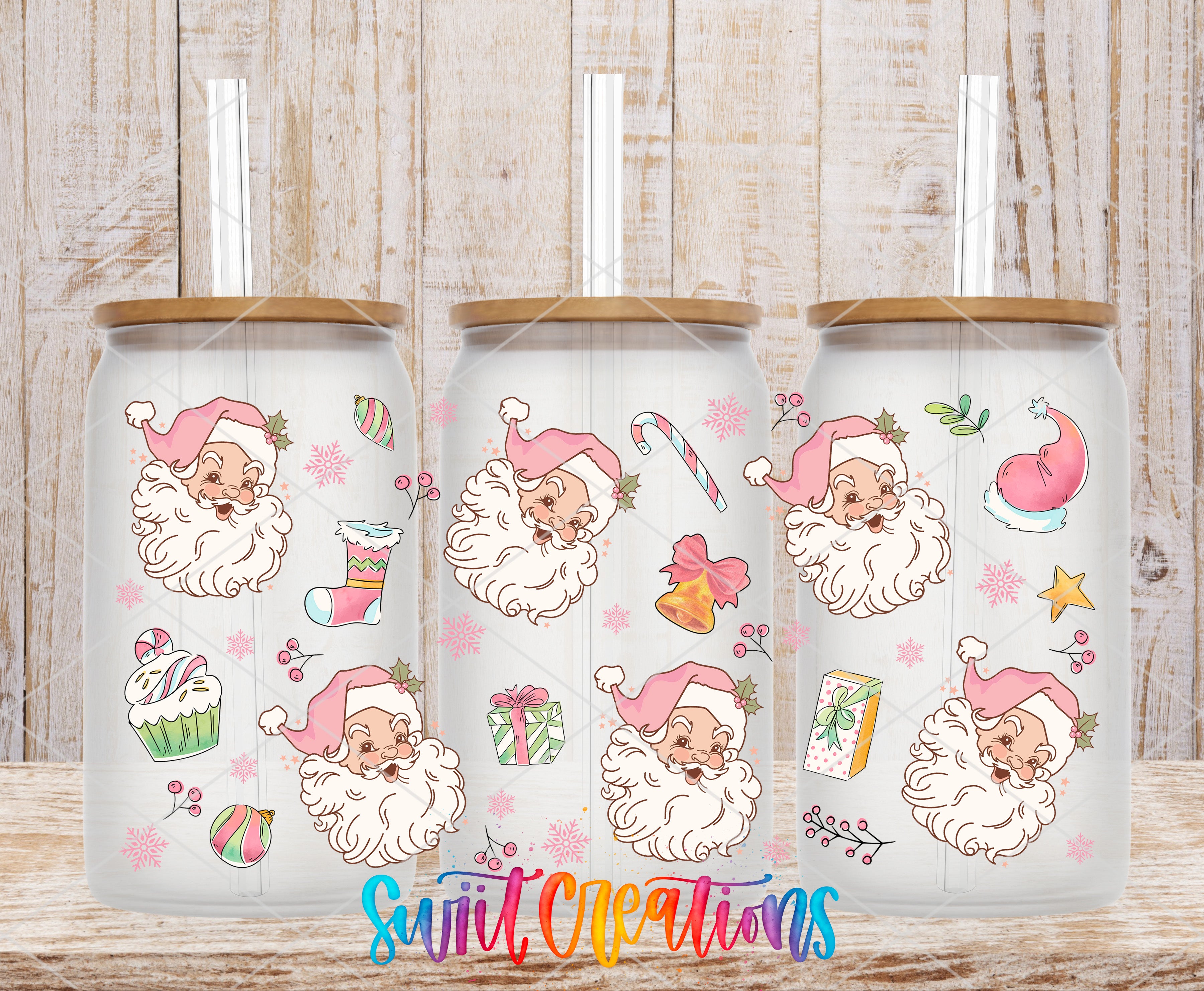 A collection of three glass tumblers with a festive Christmas-themed design featuring Santa Claus and various holiday-related items such as snowflakes, candy canes, and presents.