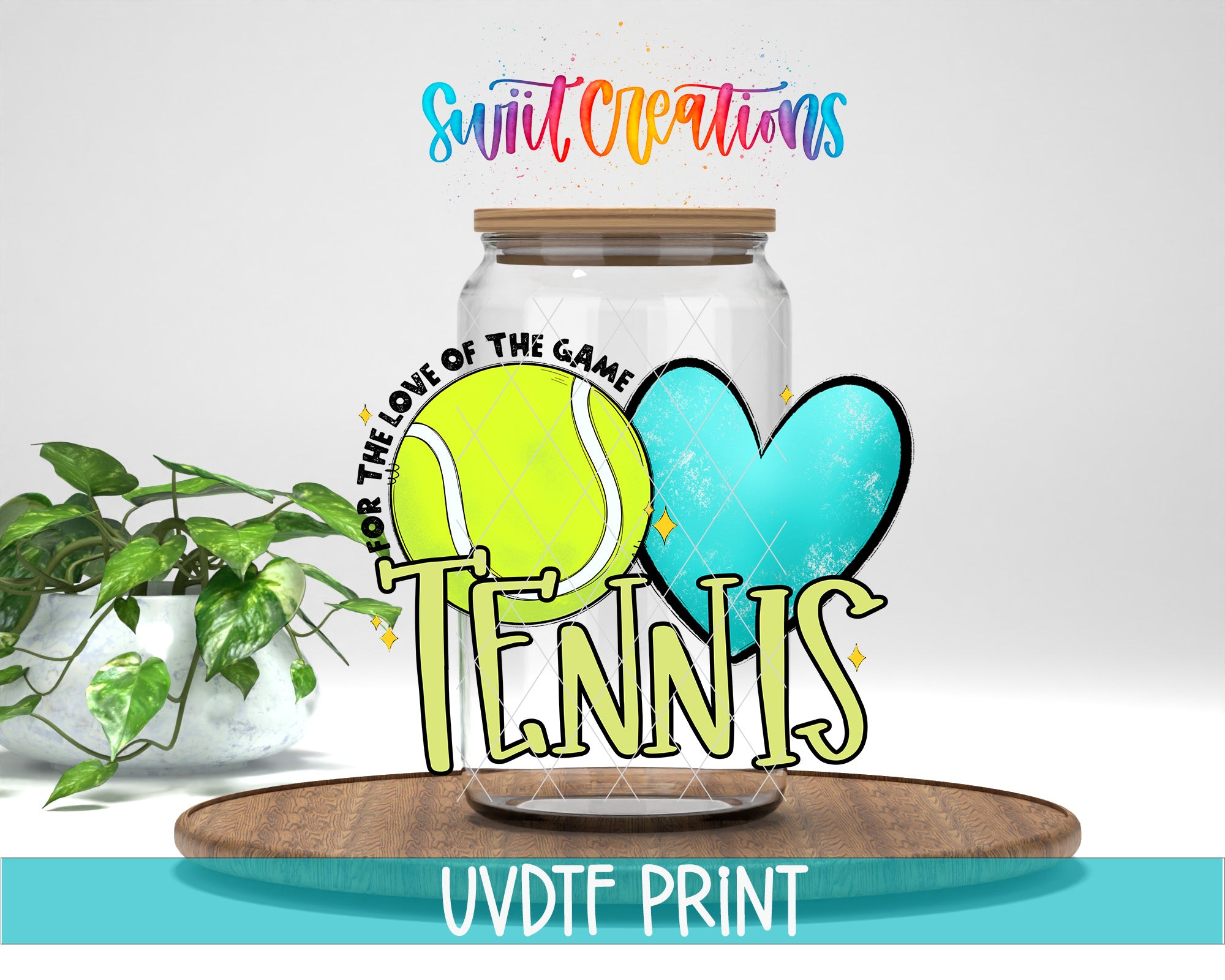 A glass jar with a tennis ball inside, surrounded by a heart and the word "TENNIS" written on it. The jar is placed on a wooden surface, and there is a plant in the background.