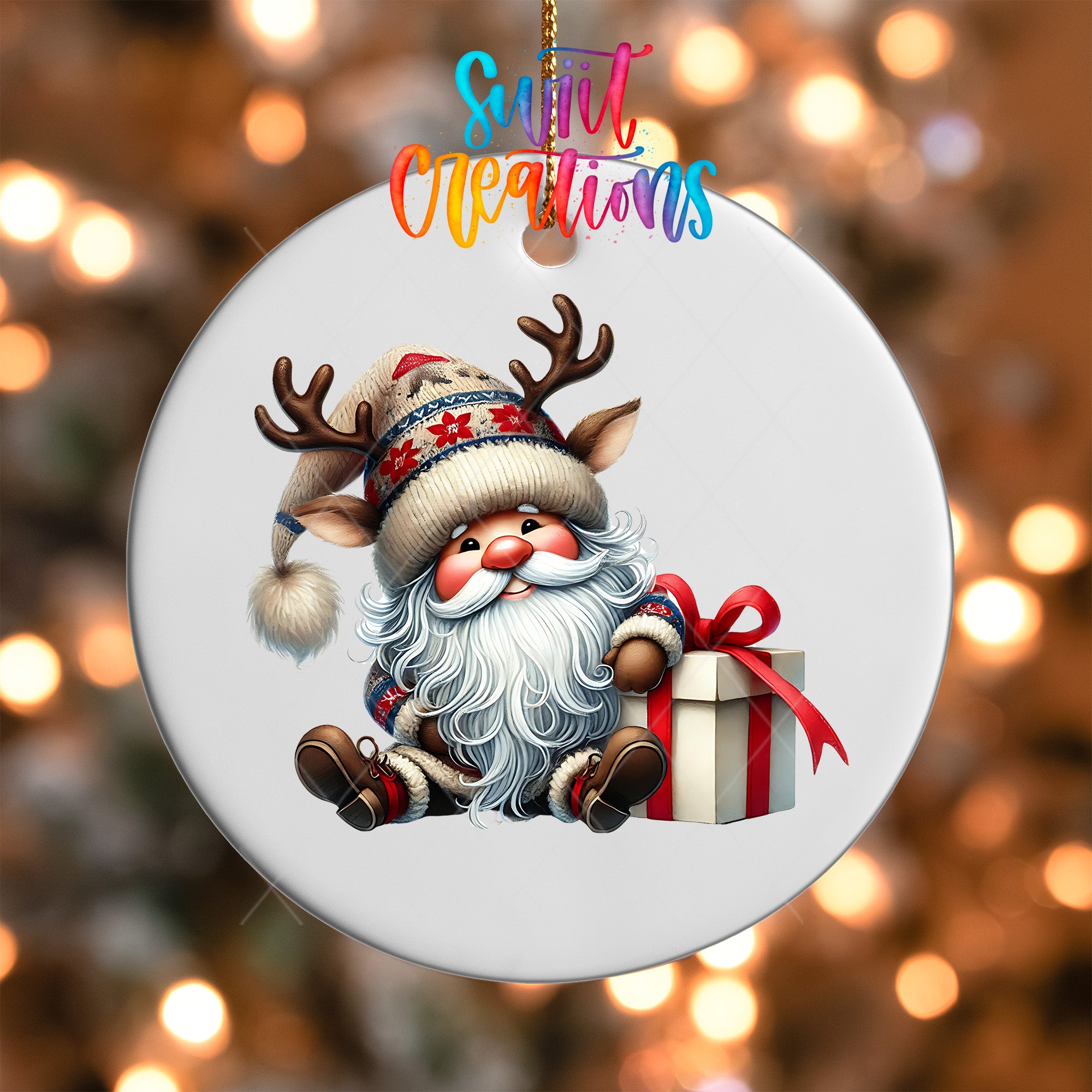 A white ornament featuring a cartoon Santa Claus holding a gift box and wearing a reindeer hat.
