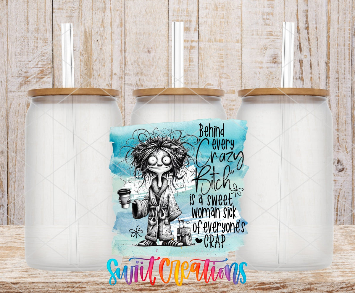 Swiit Creations UV DTF Behind Every Crazy Bitch transfer shown on a clear glass can set