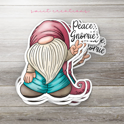 a sticker of a gnome holding a sign that says peace gnomeie's