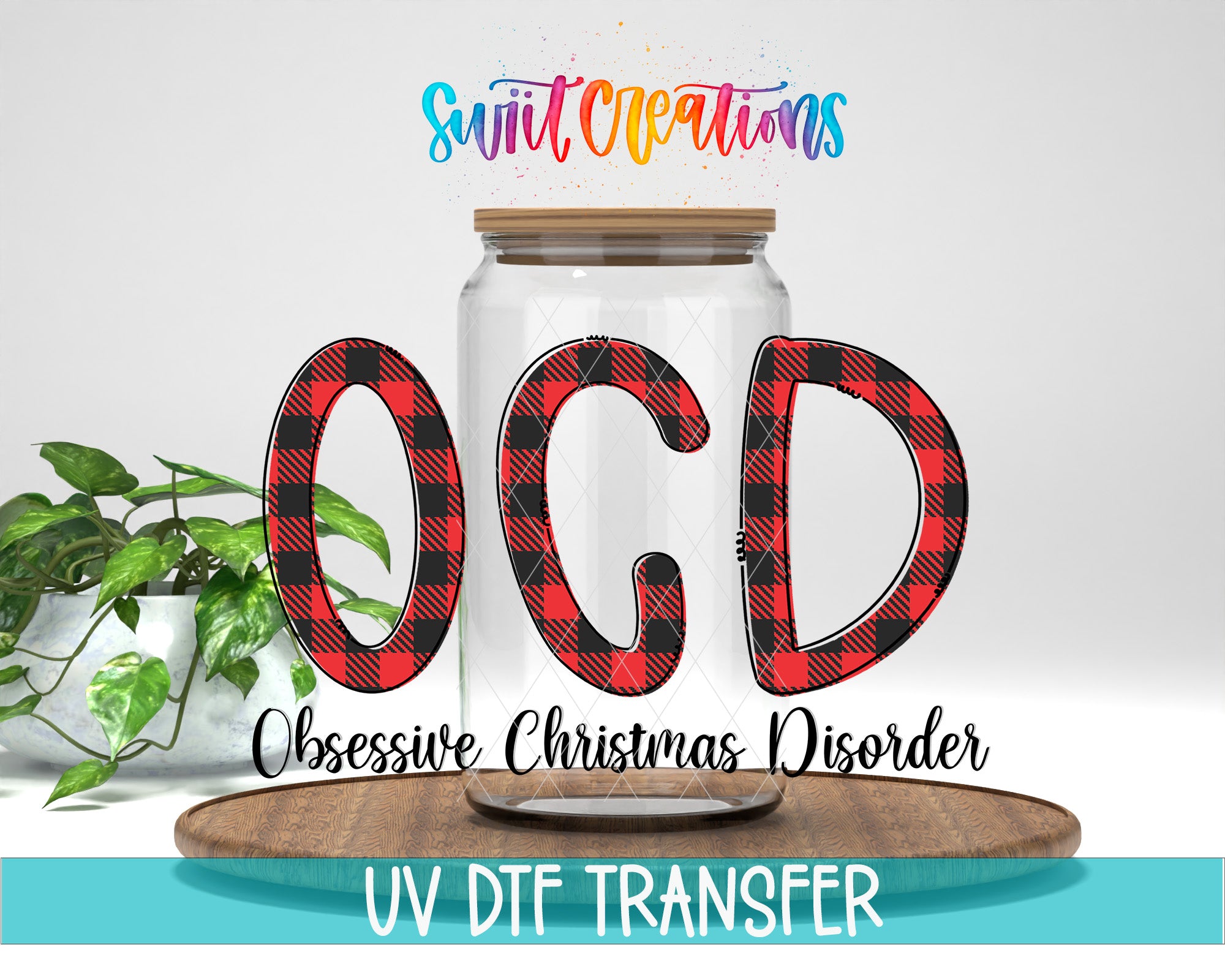 a jar with the letters "OCD" written on it, along with the text "Obsessive Christmas Disorder" below it. The jar is placed on a wooden surface, and there is a plant in the background.