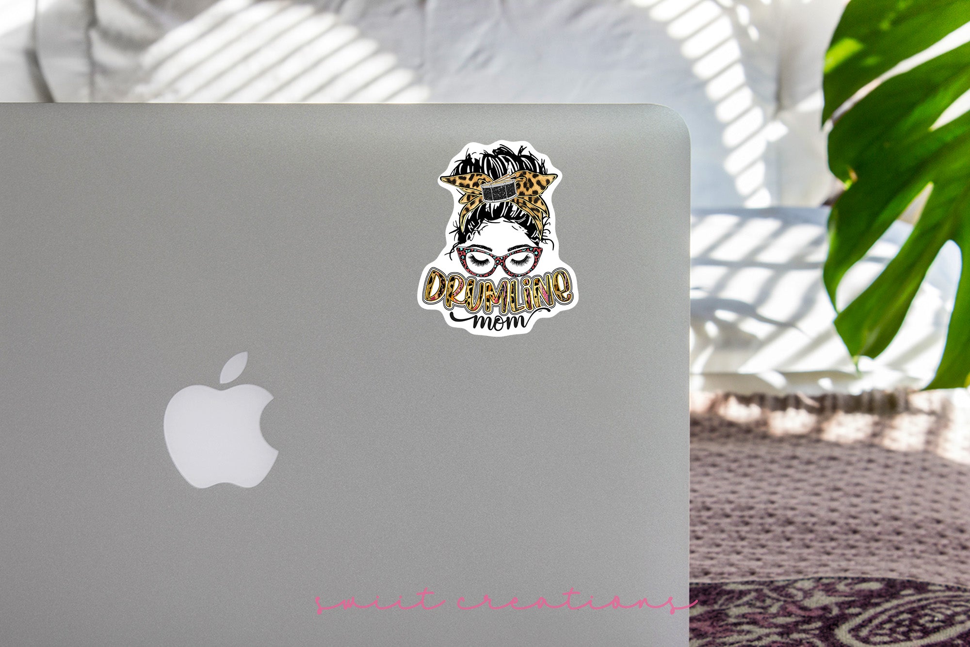 a laptop with a sticker of a woman's face