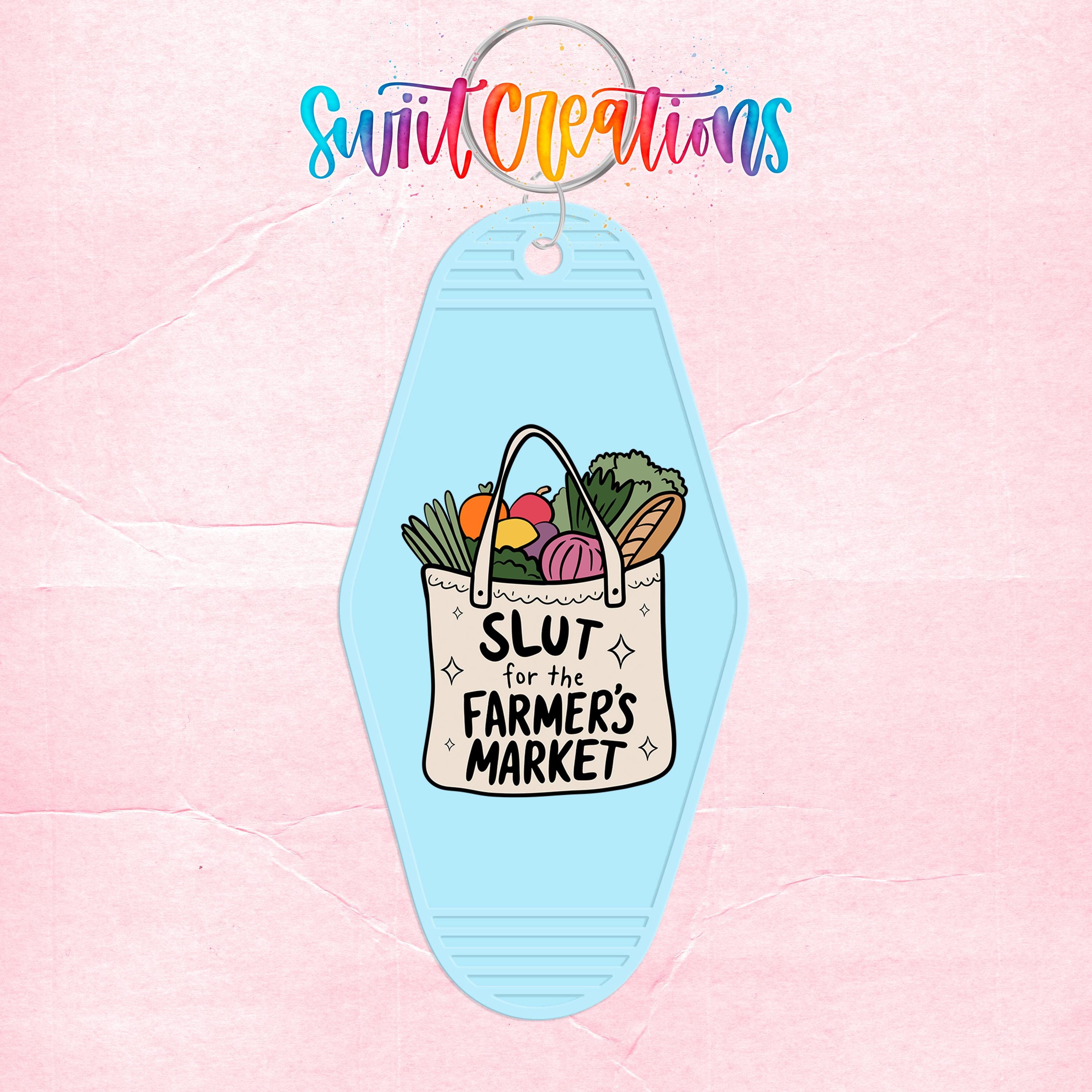 A keychain with a graphic design featuring a bag of produce and the text "SLUT for the FARMERS MARKET" printed on it.