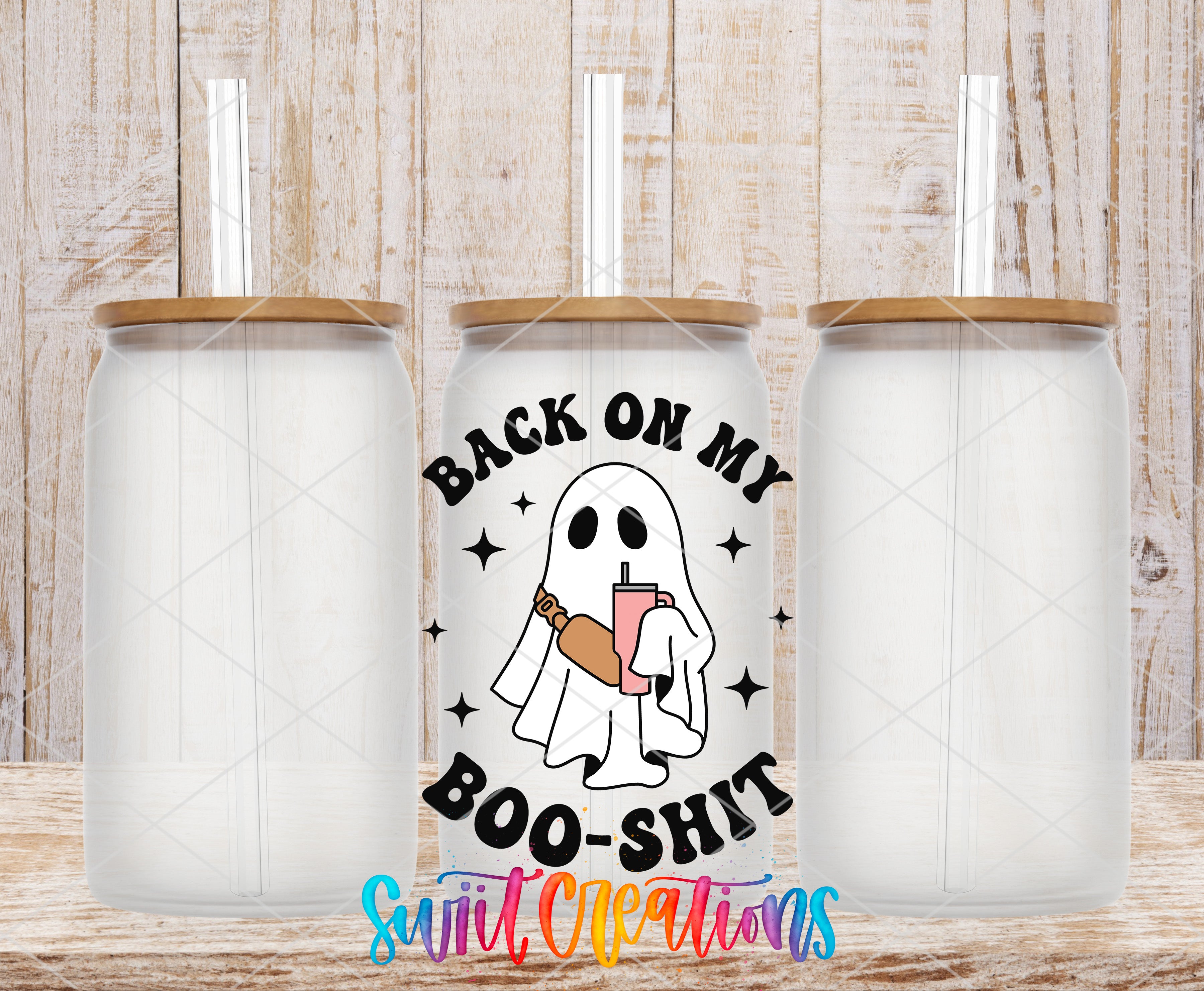 three clear glass tumblers with straws, each with a lid and a printed design on the front. The design includes a ghost holding a drink and the text "BACK ON MY BOO-SHIT" in a playful, humorous font.