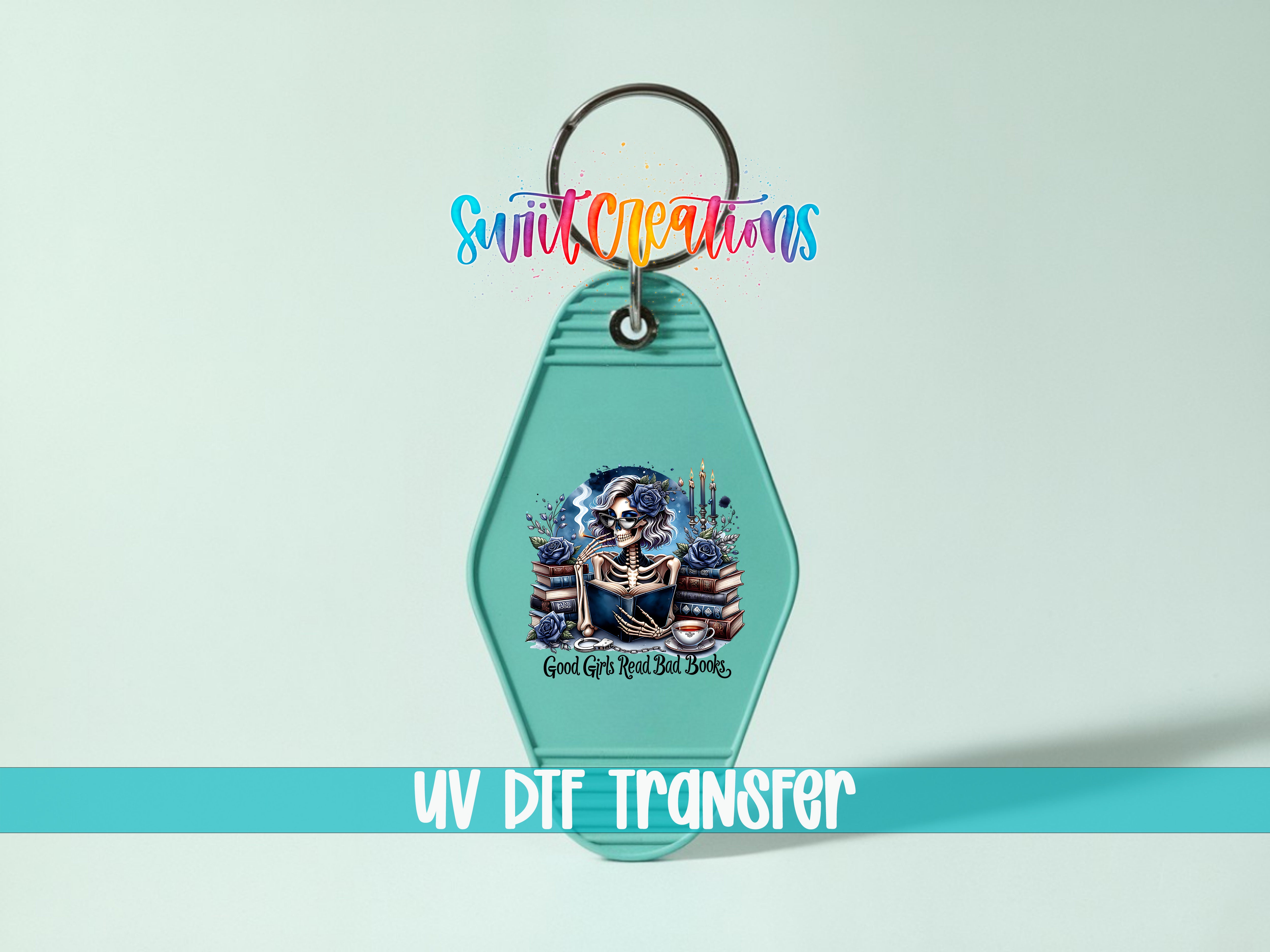 A keychain with a graphic design featuring a skeleton and various objects, along with the text "UV DIF TRANSFER" and "Swift Creations" written above it.