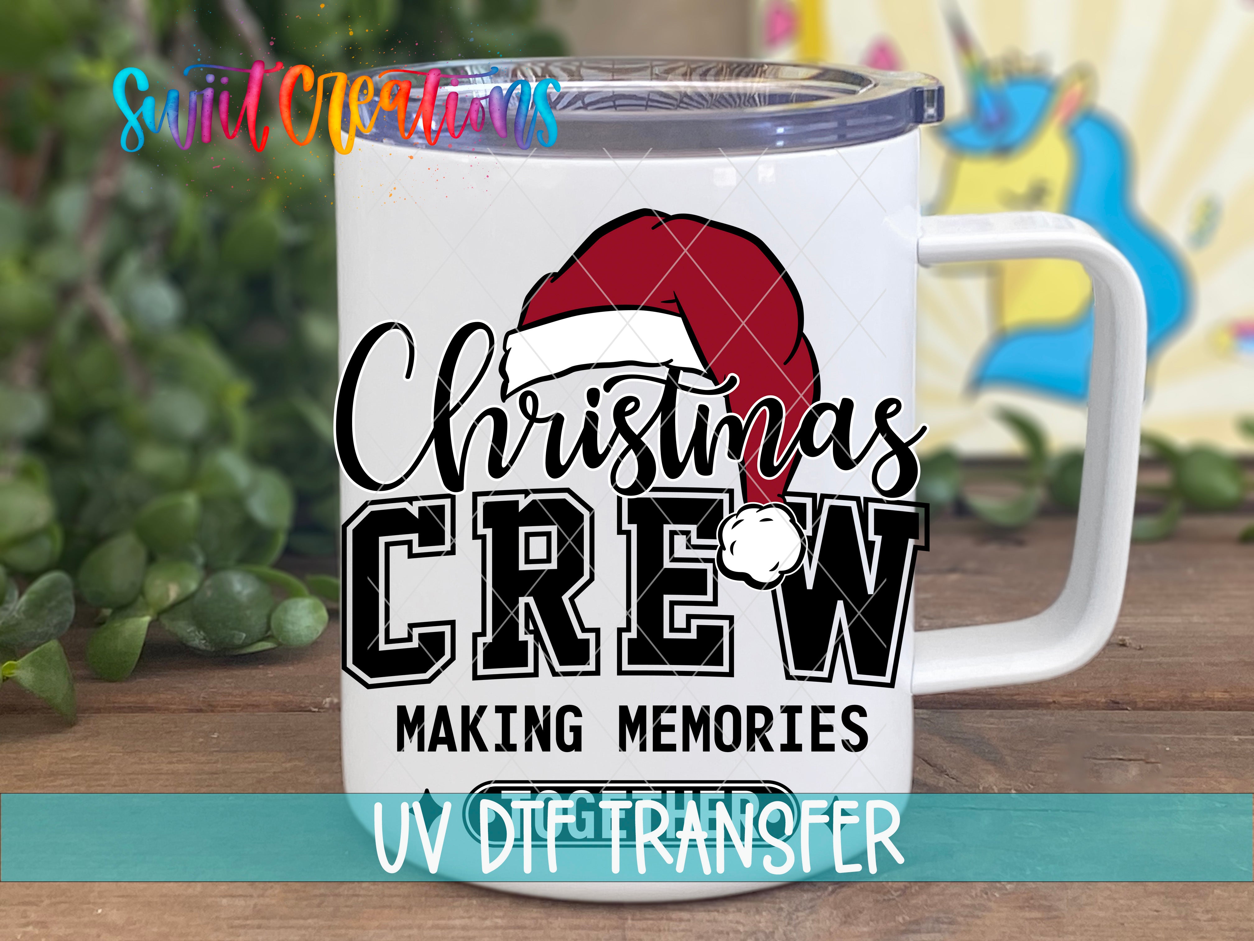 A white mug with a Christmas-themed design, including a Santa hat and the text "Christmas Crew" and "Making memories".