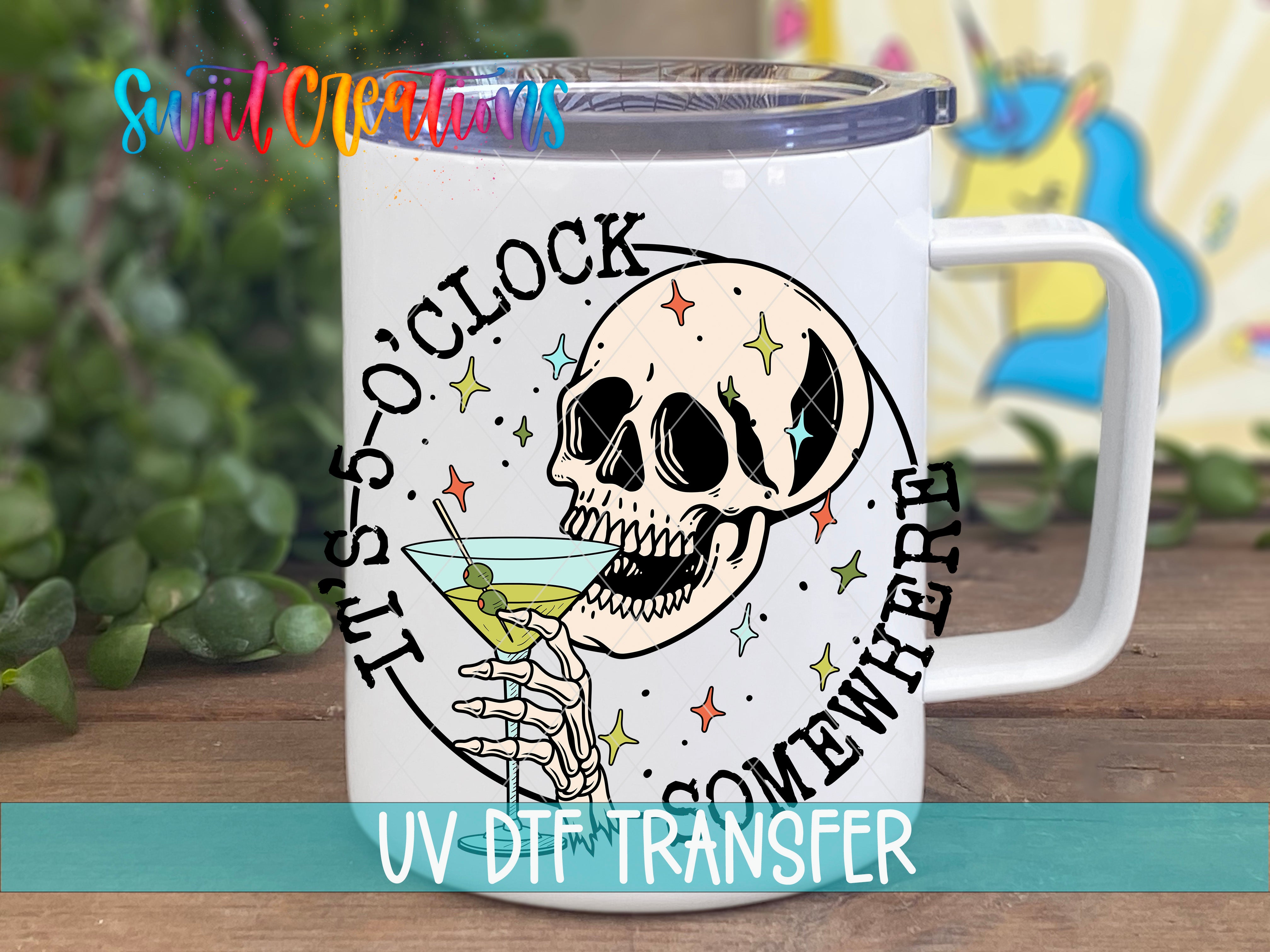 A white mug with a skull design and the text "SOMEWHERE" printed on it, along with a starry background.