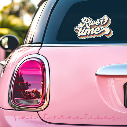 a pink car with a sticker that says river time