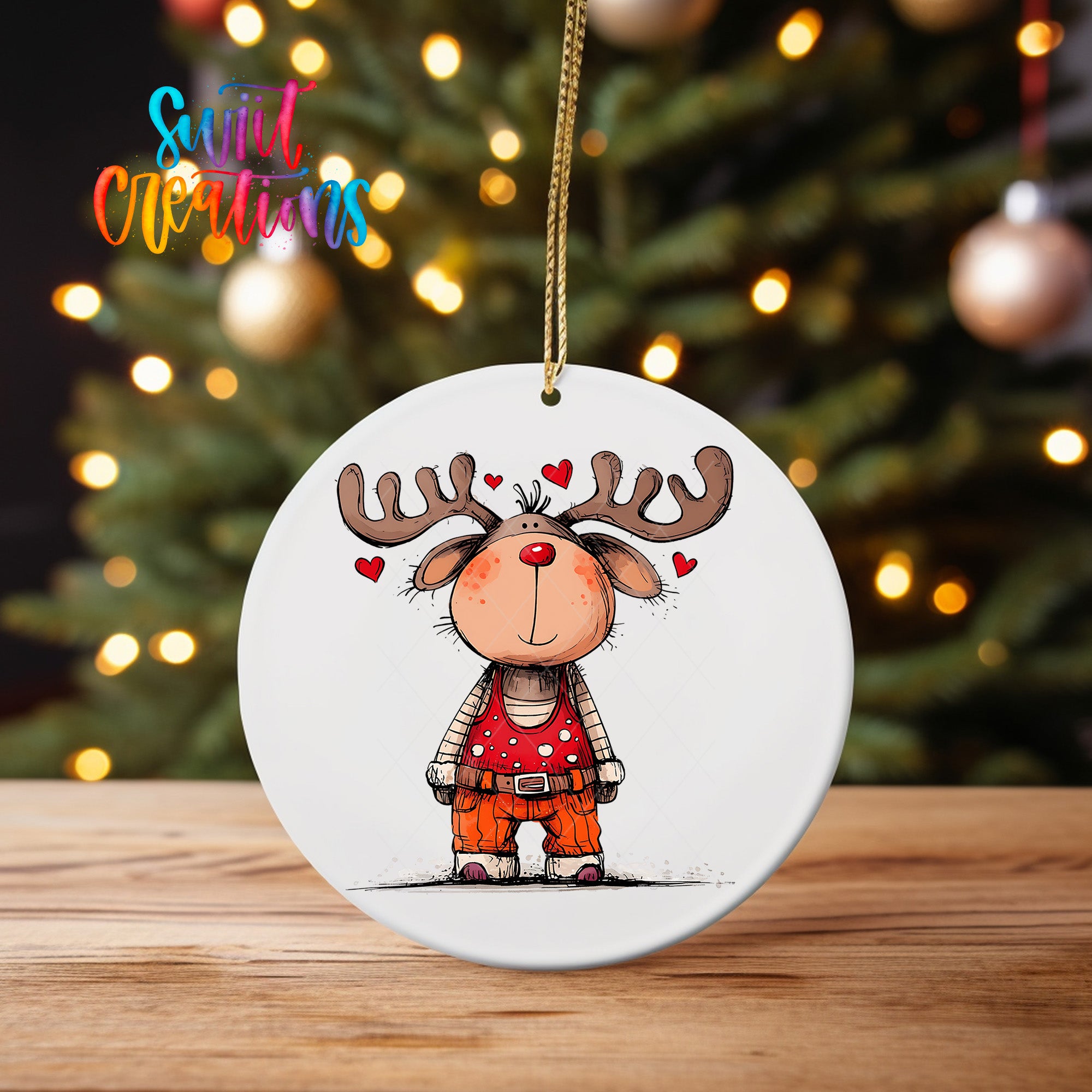 A white oval ornament featuring a cartoon reindeer with antlers and hearts around its head, hanging on a string.