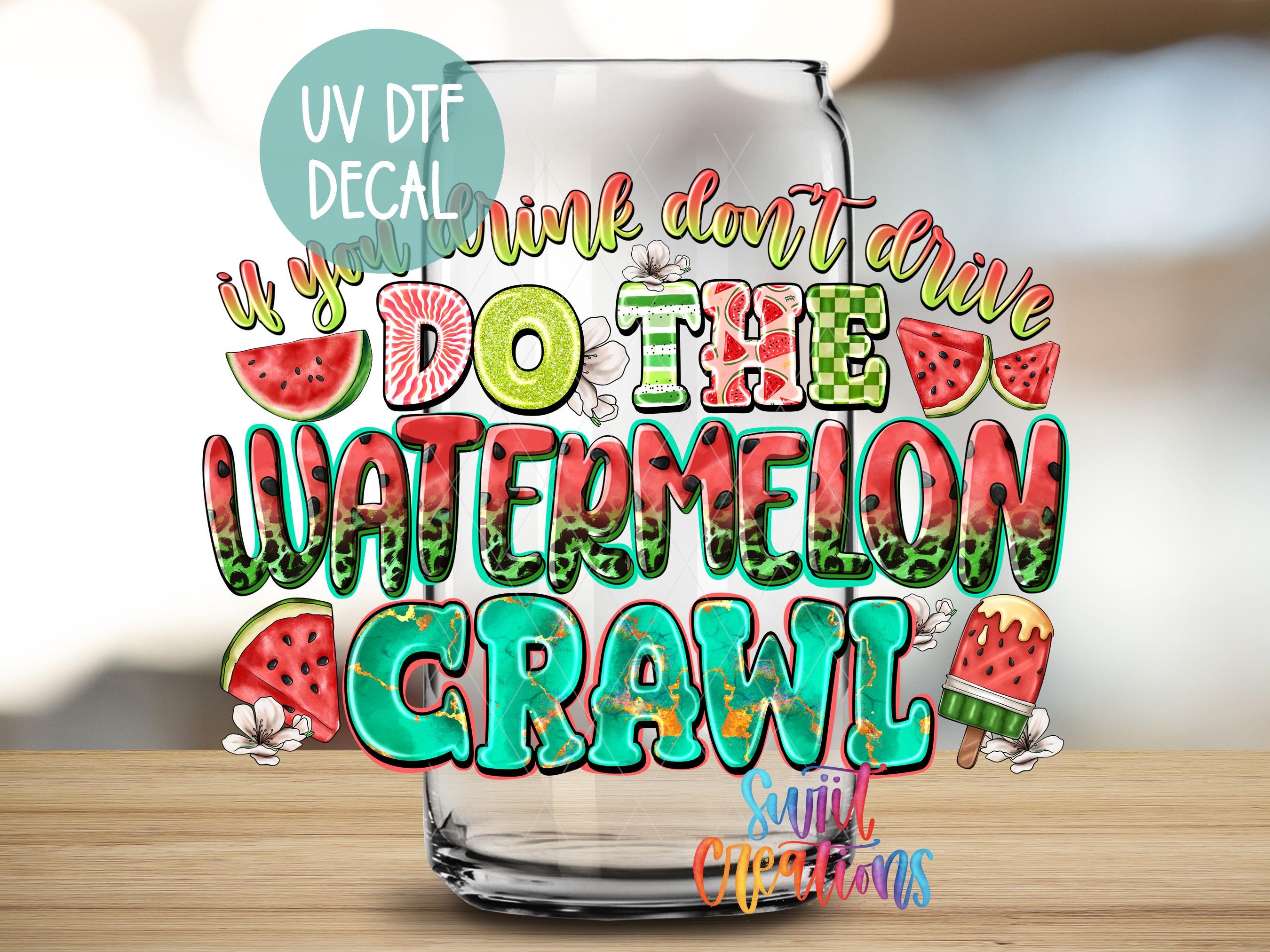 a watermelon glass sitting on top of a wooden table