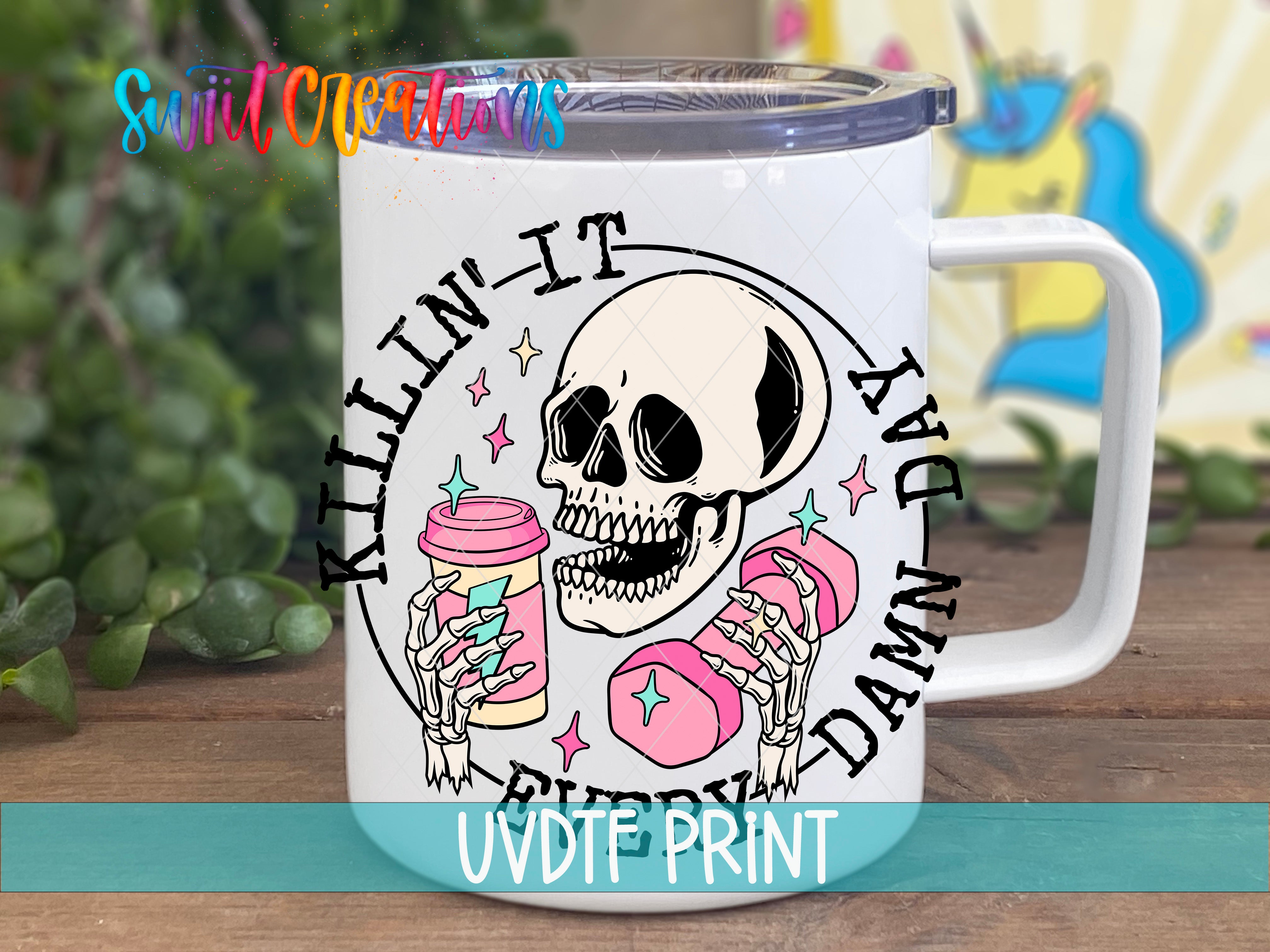 A white mug with a skull design and text printed on it.