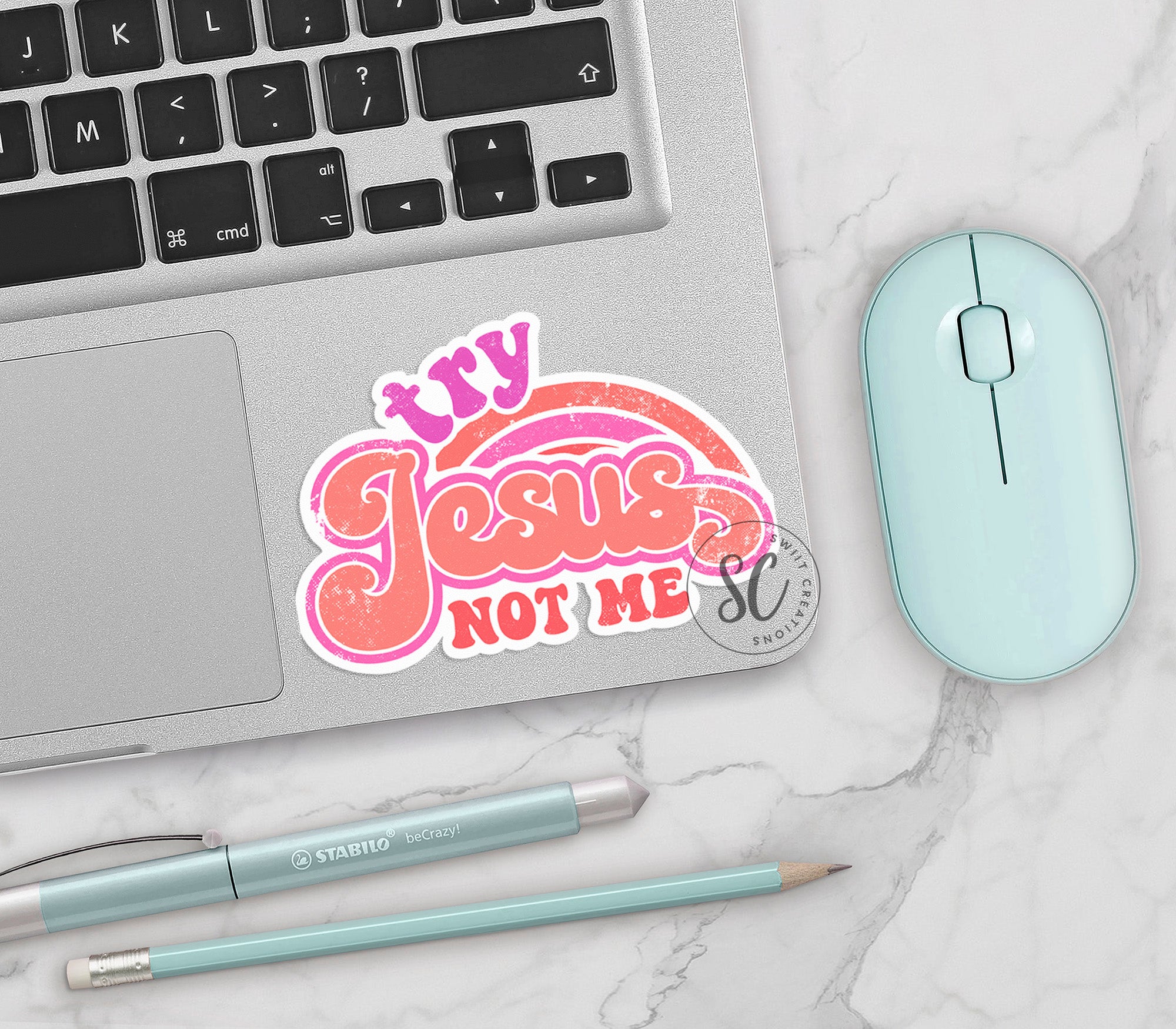 a laptop computer sitting next to a mouse and keyboard