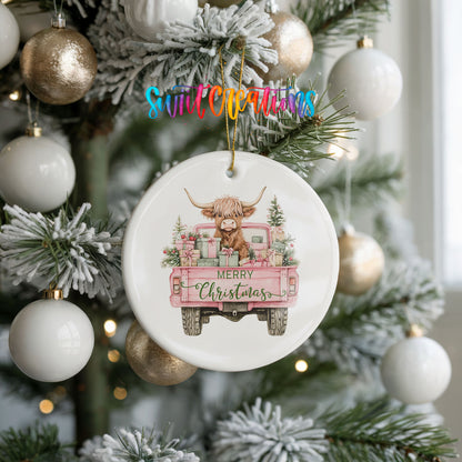A Christmas tree decorated with ornaments, including a ceramic ornament featuring a cow and the text "Merry Christmas".