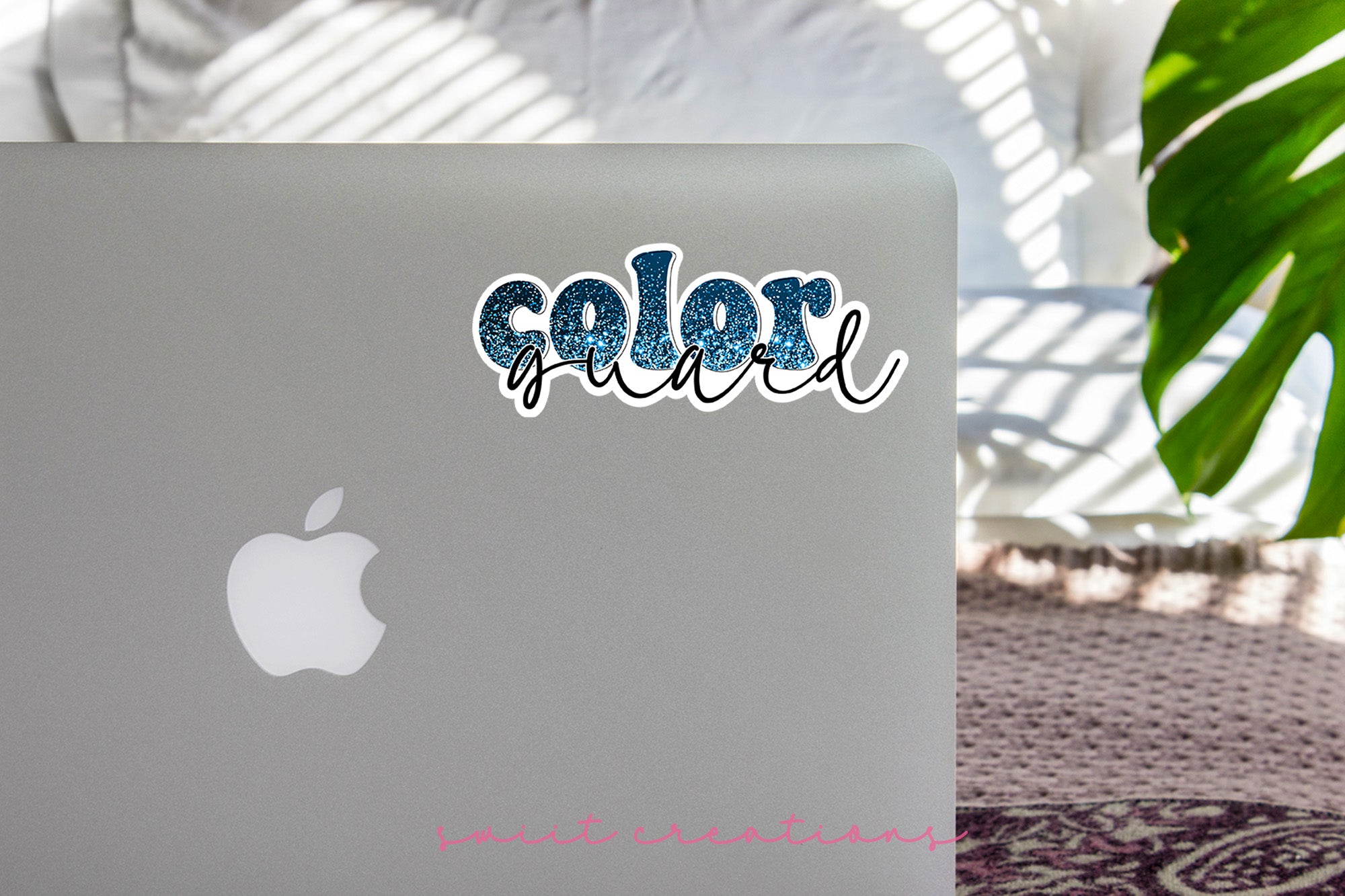 a laptop computer sitting on top of a table