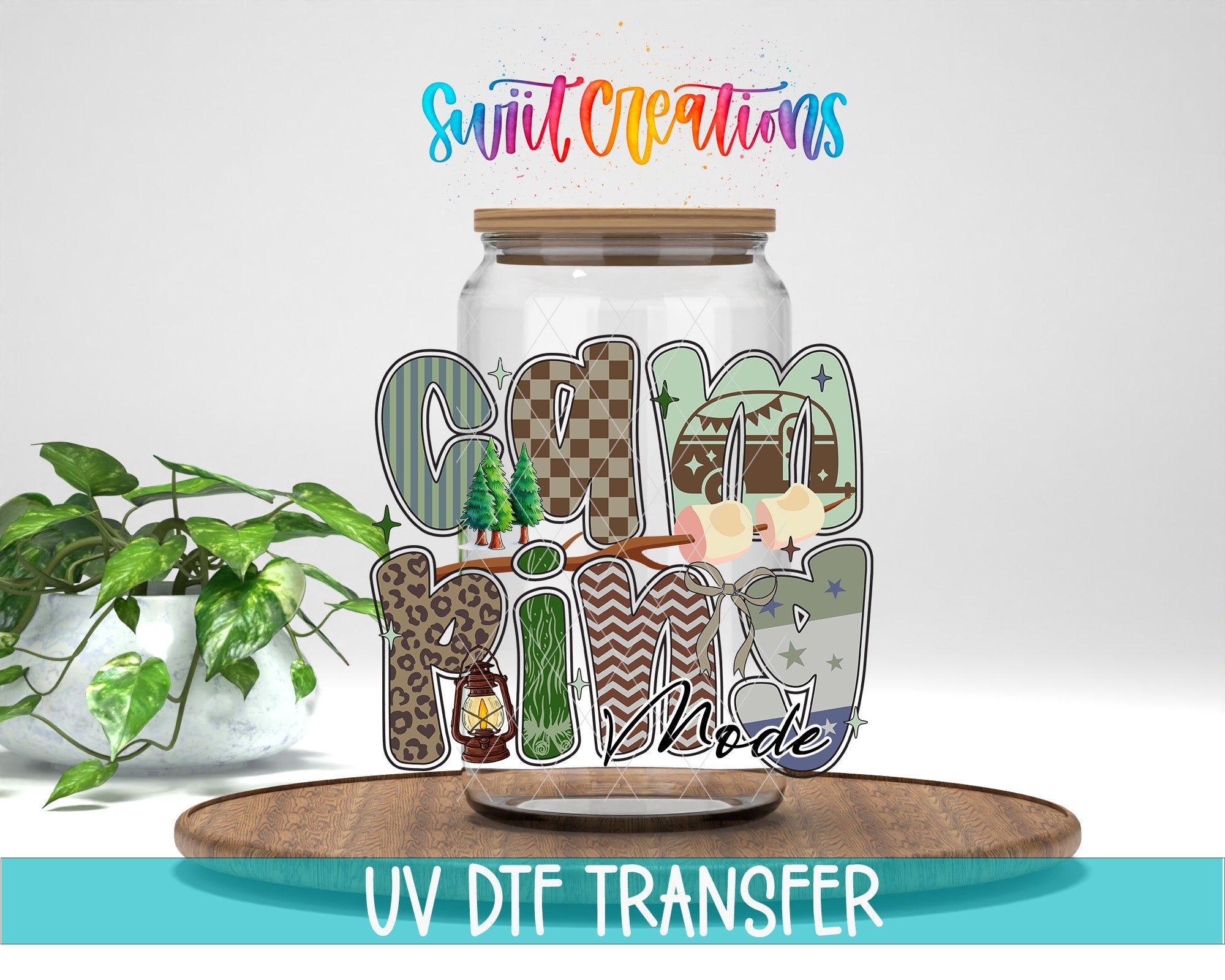a glass jar with the word "Camping" written on it, along with various camping-related elements such as a tent, lantern, and stars. The jar is placed on a wooden surface, and there is a potted plant in the background. The image also includes text that says "Swit Creations" and "UV DFT TRANSFER", suggesting that the image may be a creative design or promotional material.