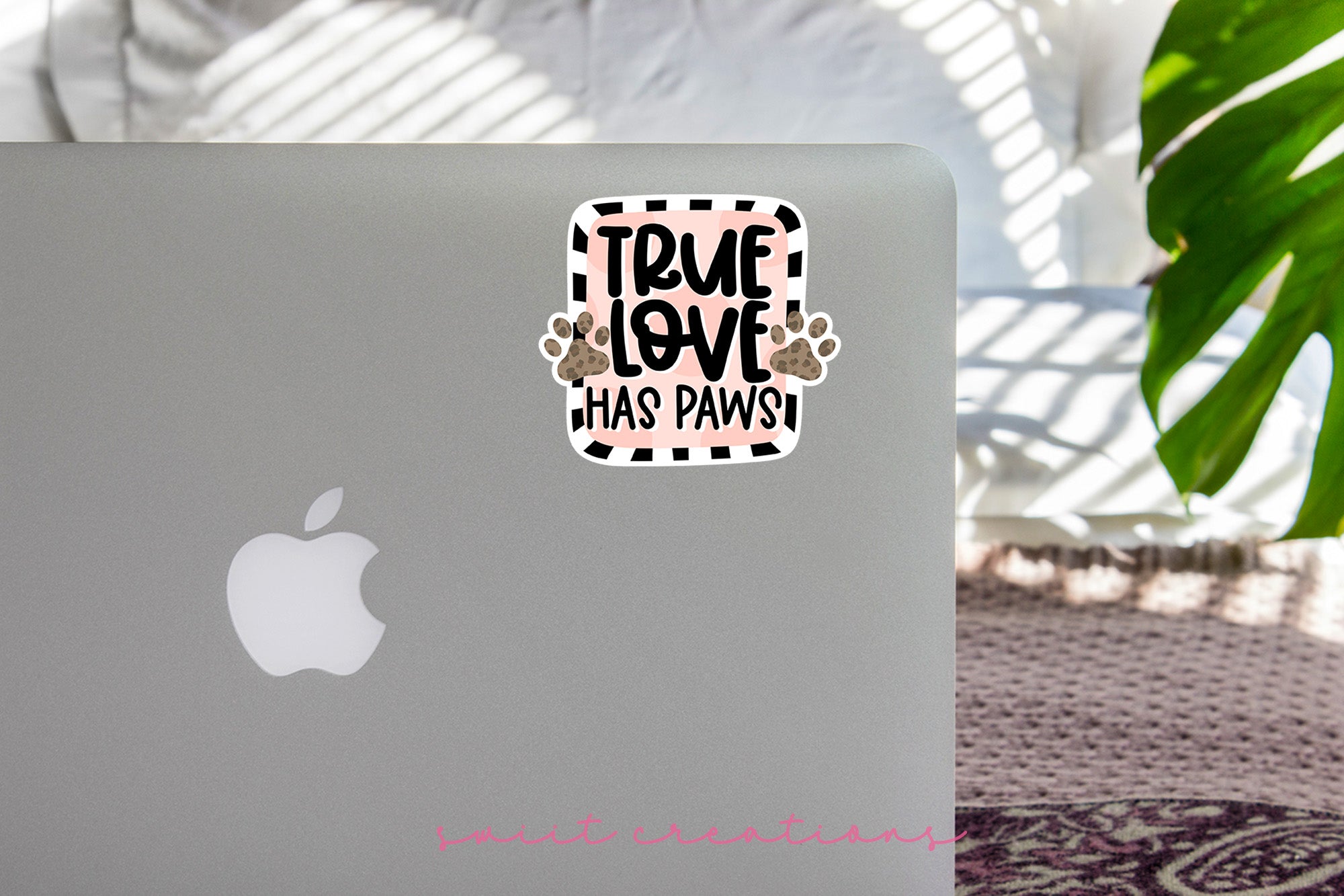 a laptop computer sitting on top of a table