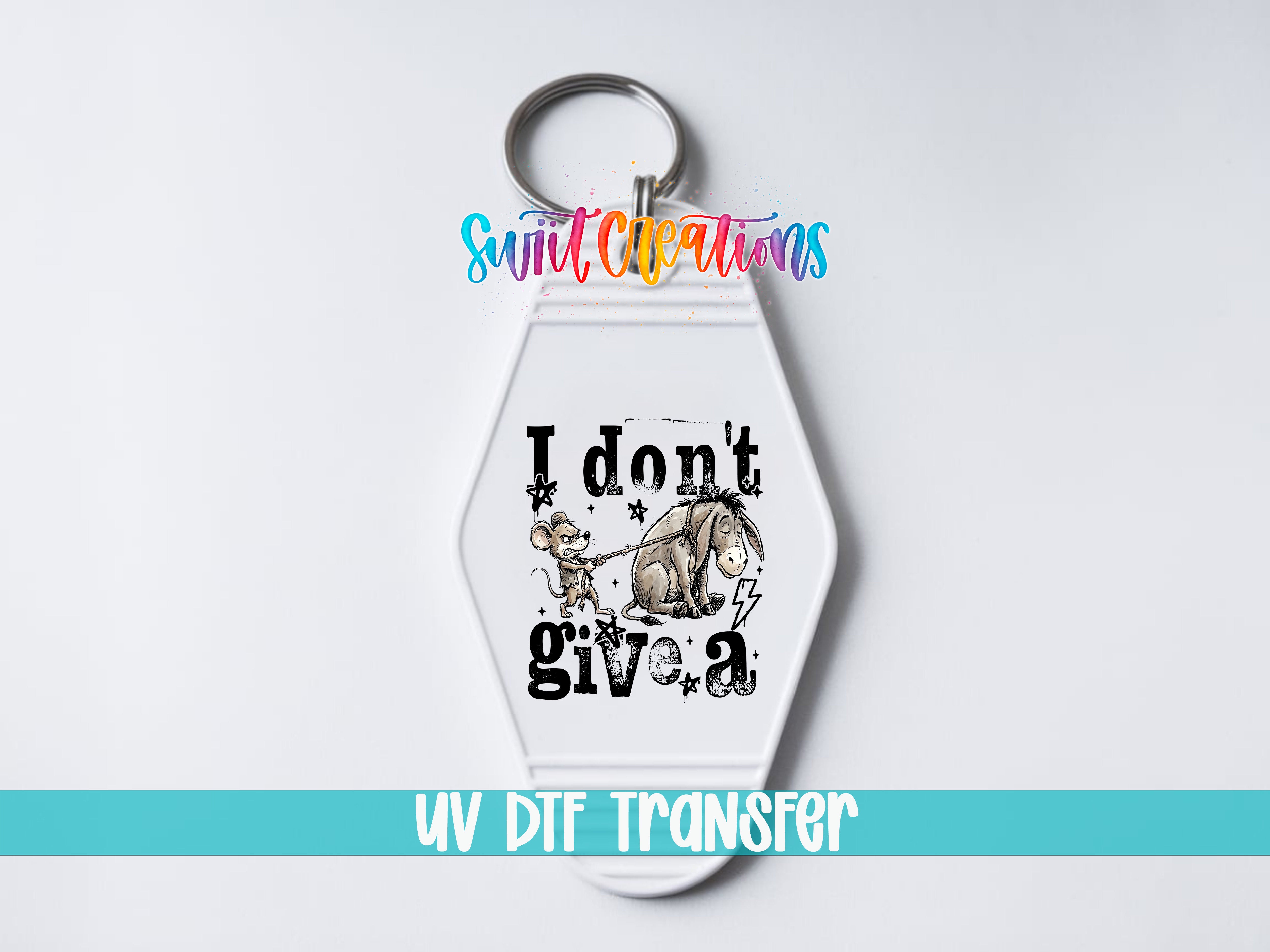 A keychain with a cartoon image of Eeyore and the text "I don't give a" printed on it.