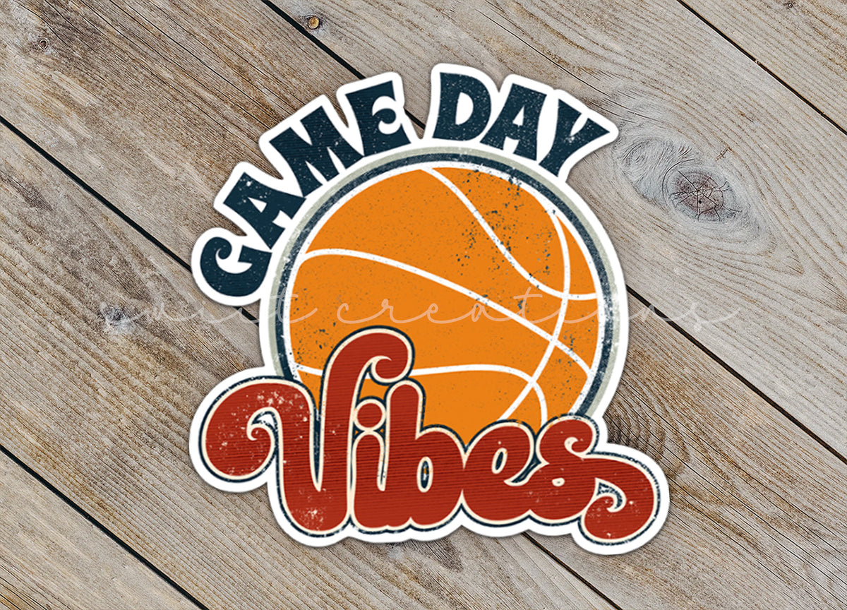 a sticker that says game day vibes on a wooden surface