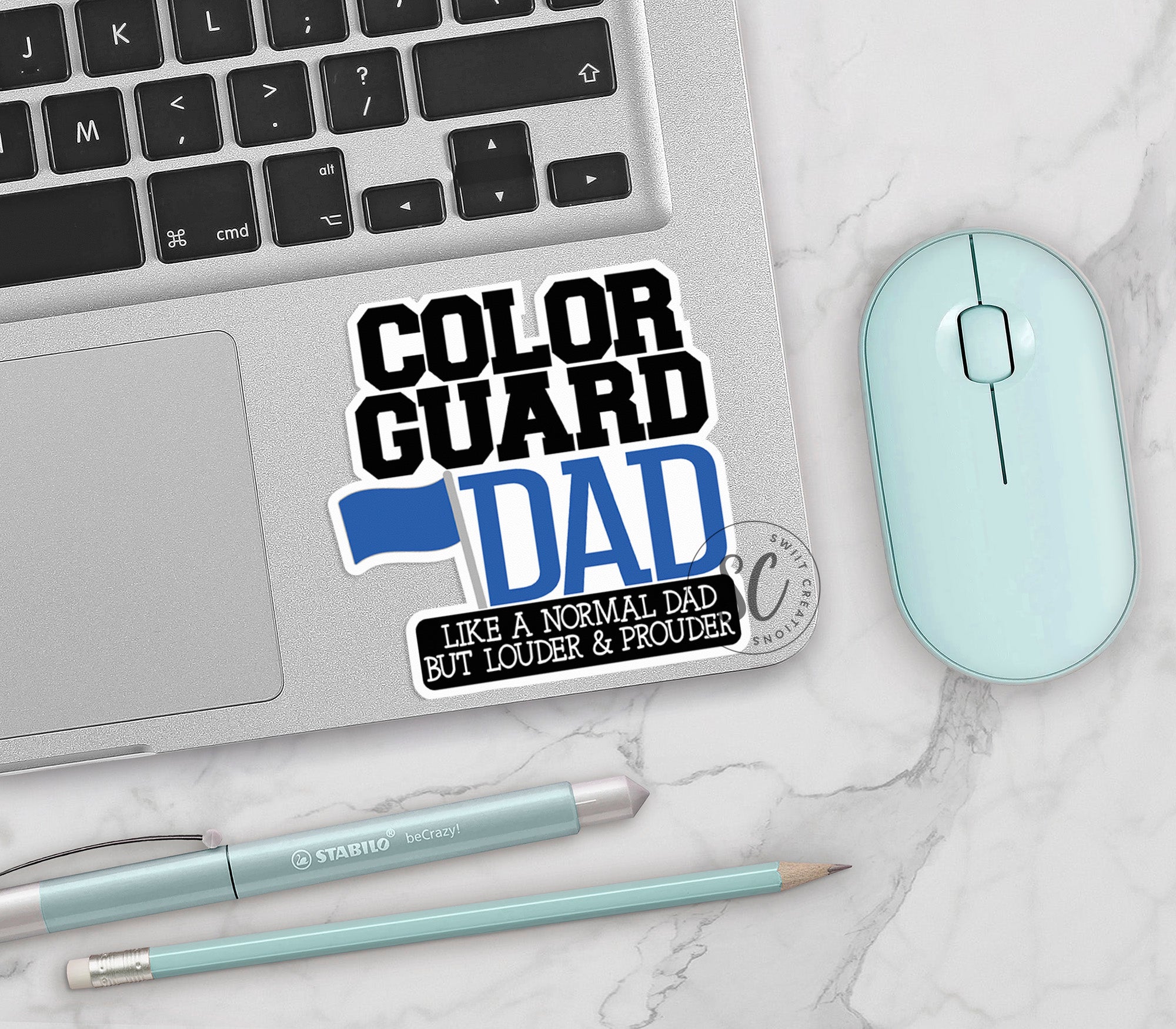 a laptop computer sitting next to a mouse and keyboard