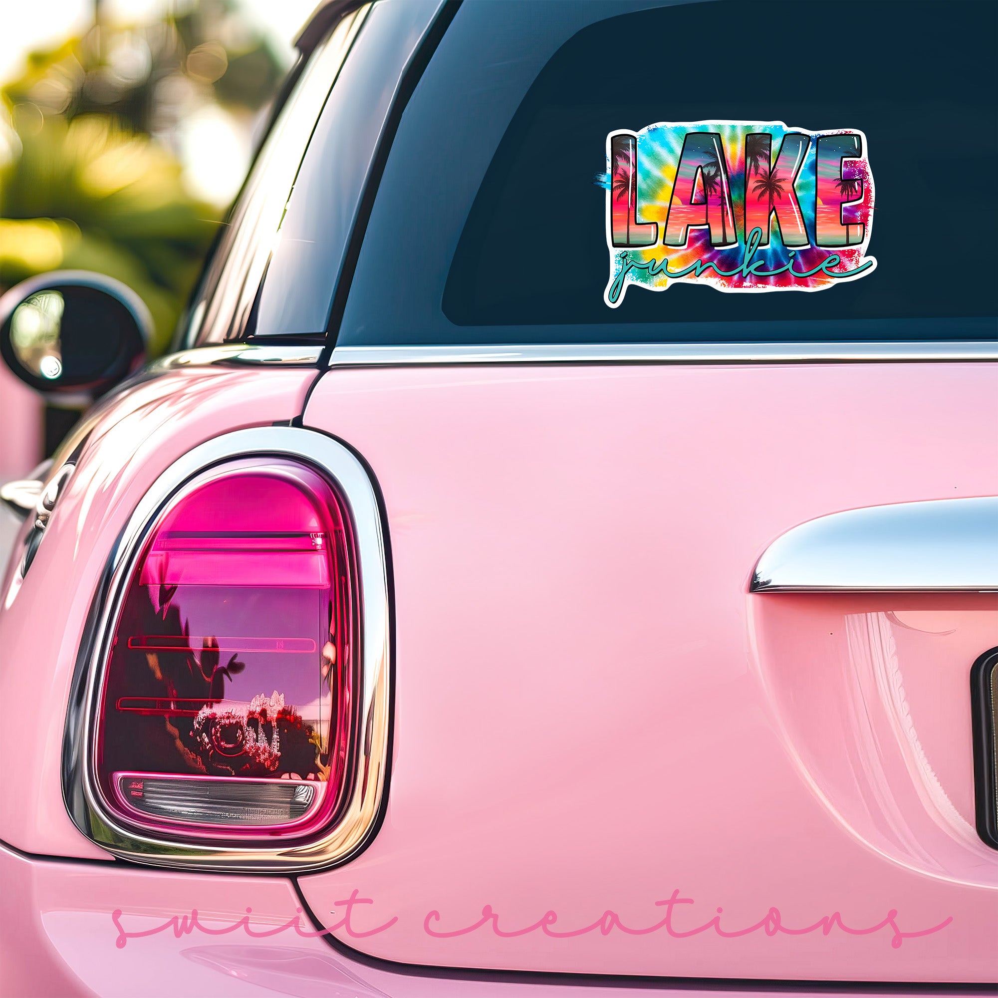 a pink car with a lake sticker on it