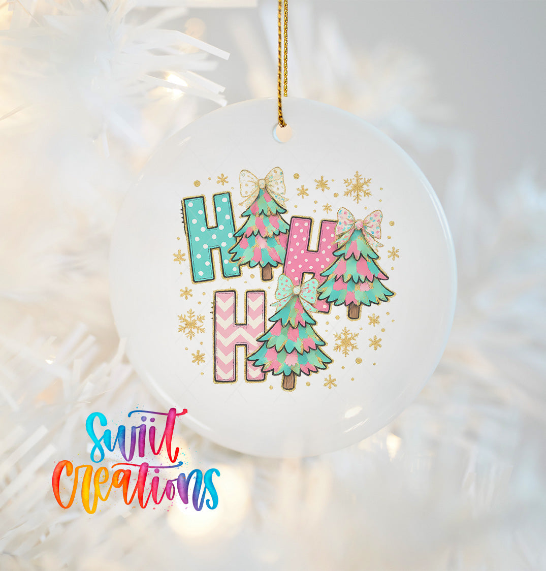 A white ornament with a colorful design featuring a Christmas tree and the text "HAPPY HAPPY HAPPY" in a playful, whimsical style.