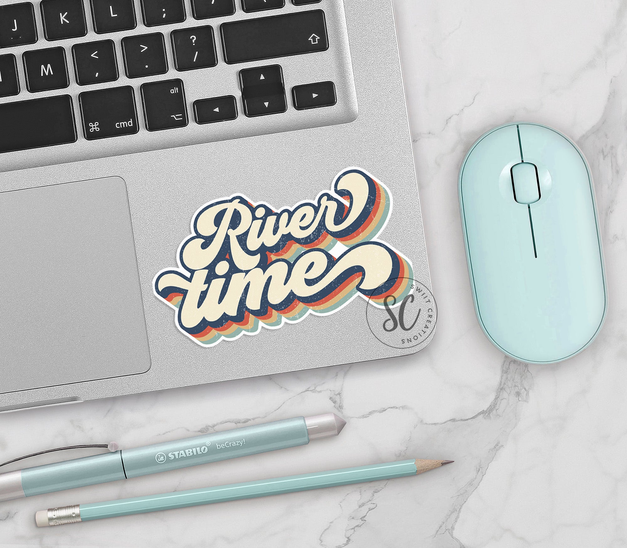 a laptop computer sitting on top of a white table