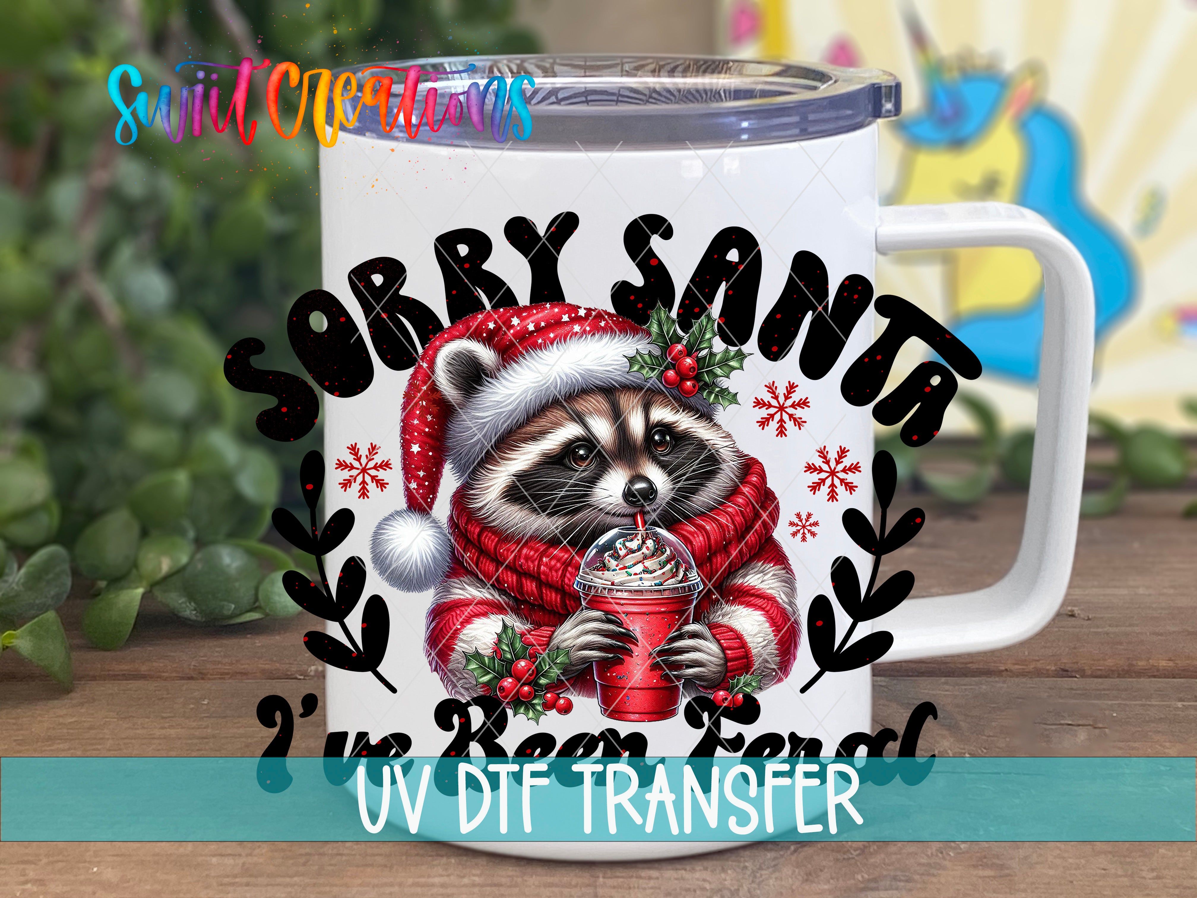 A mug with a raccoon wearing a Santa hat and scarf, holding a drink, and surrounded by snowflakes and berries.