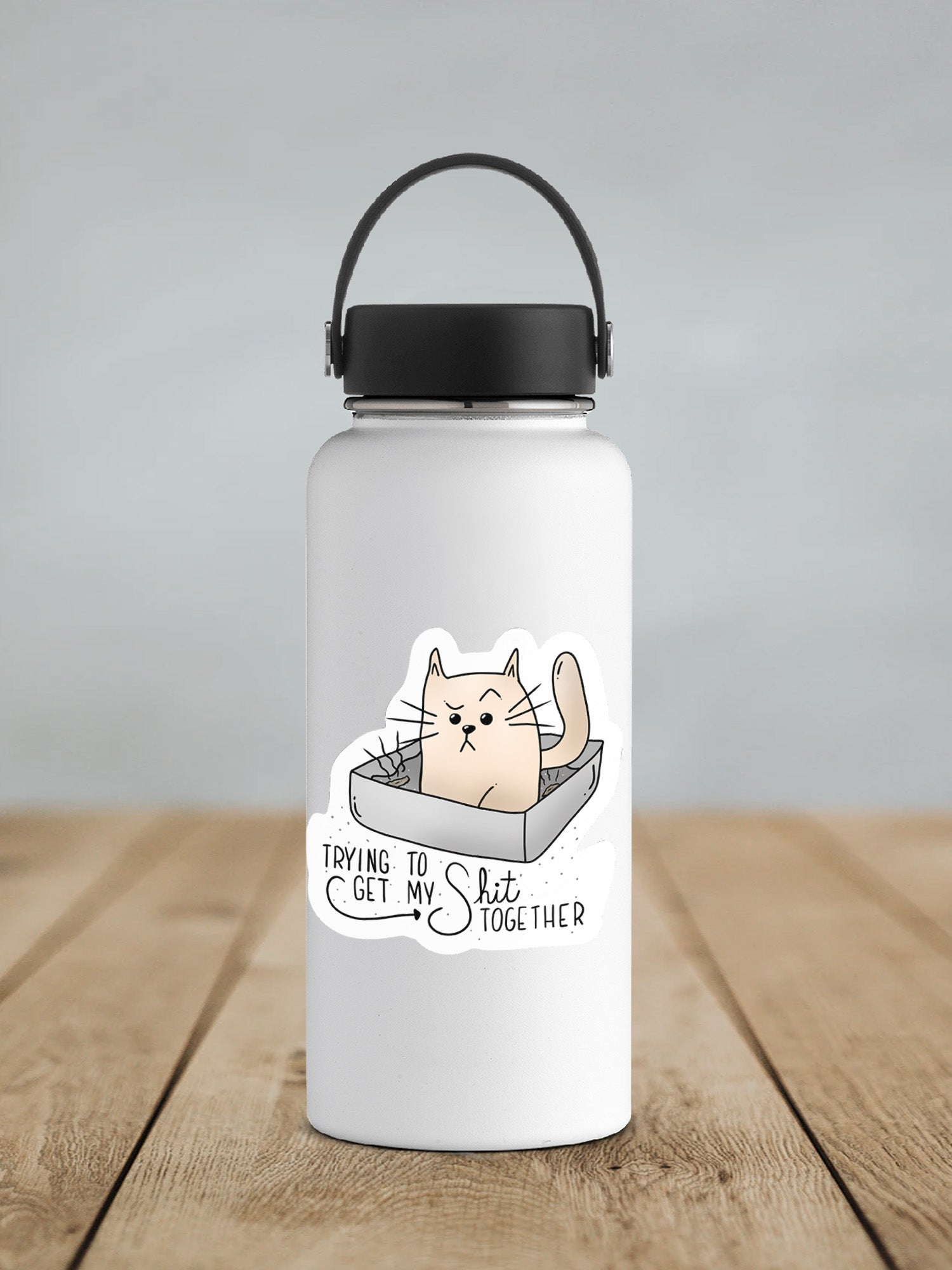 a white water bottle with a cartoon cat inside of it