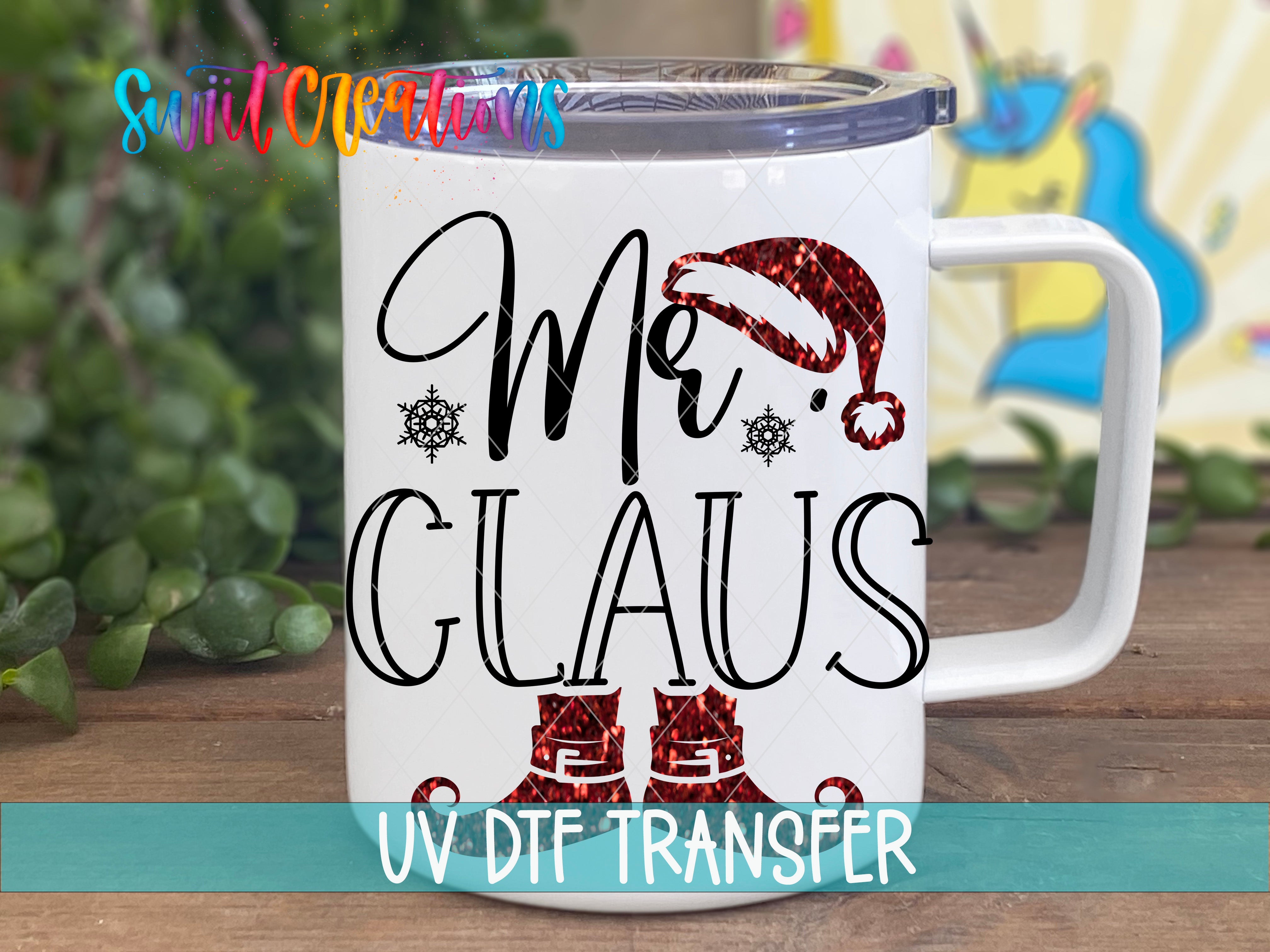 A white mug with a printed design featuring the text "Mr. Claus" and a Santa hat, along with snowflakes and red boots.