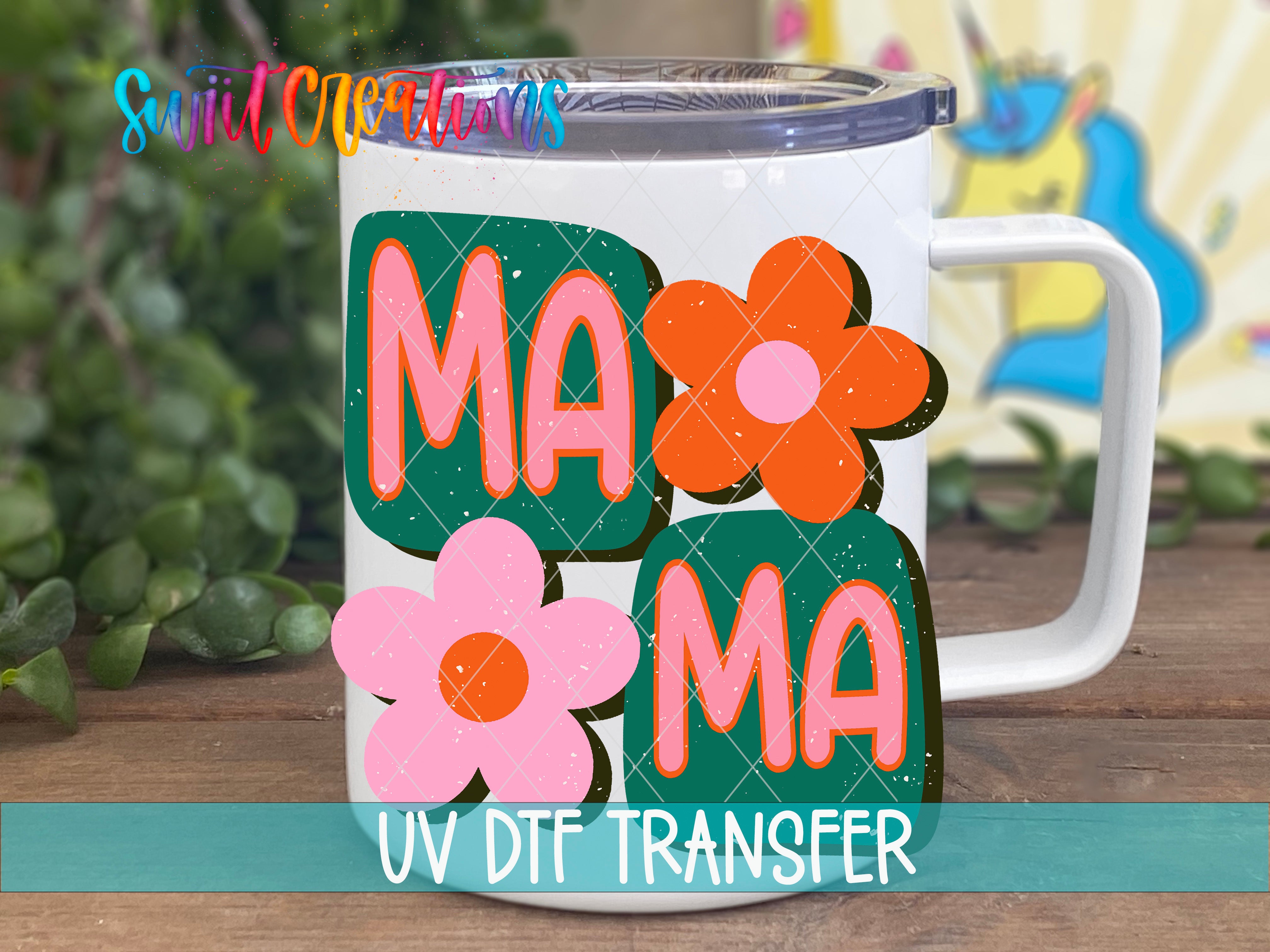 A white mug with colorful flower designs and the text "MAMMA" printed on it.