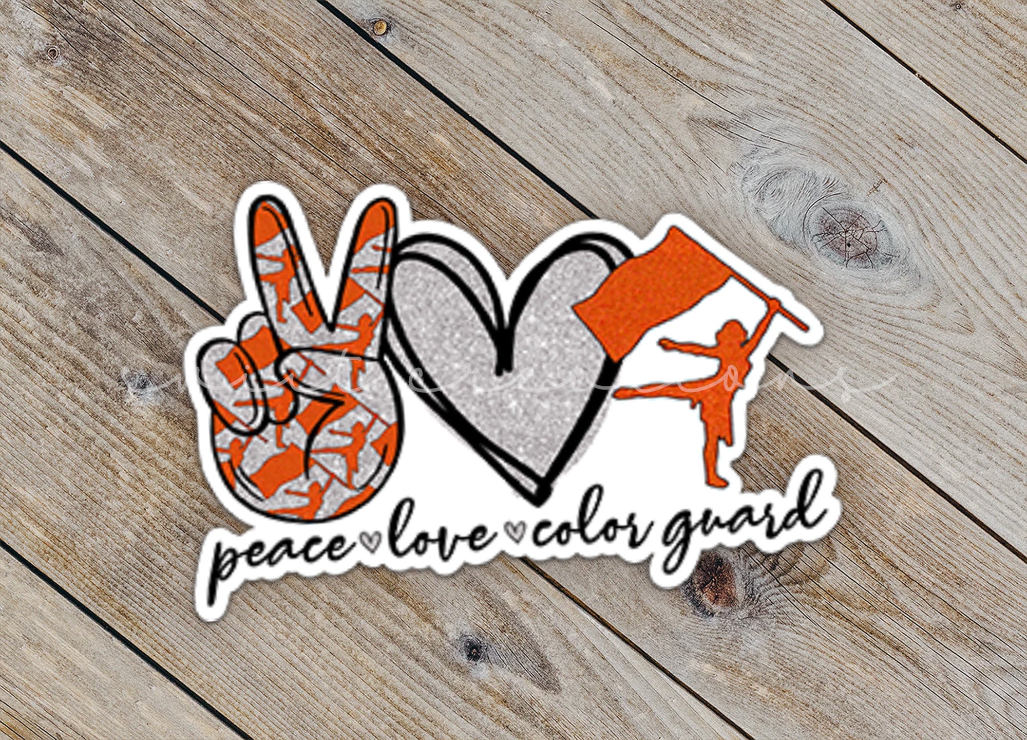 a peace and love sticker on a wooden surface