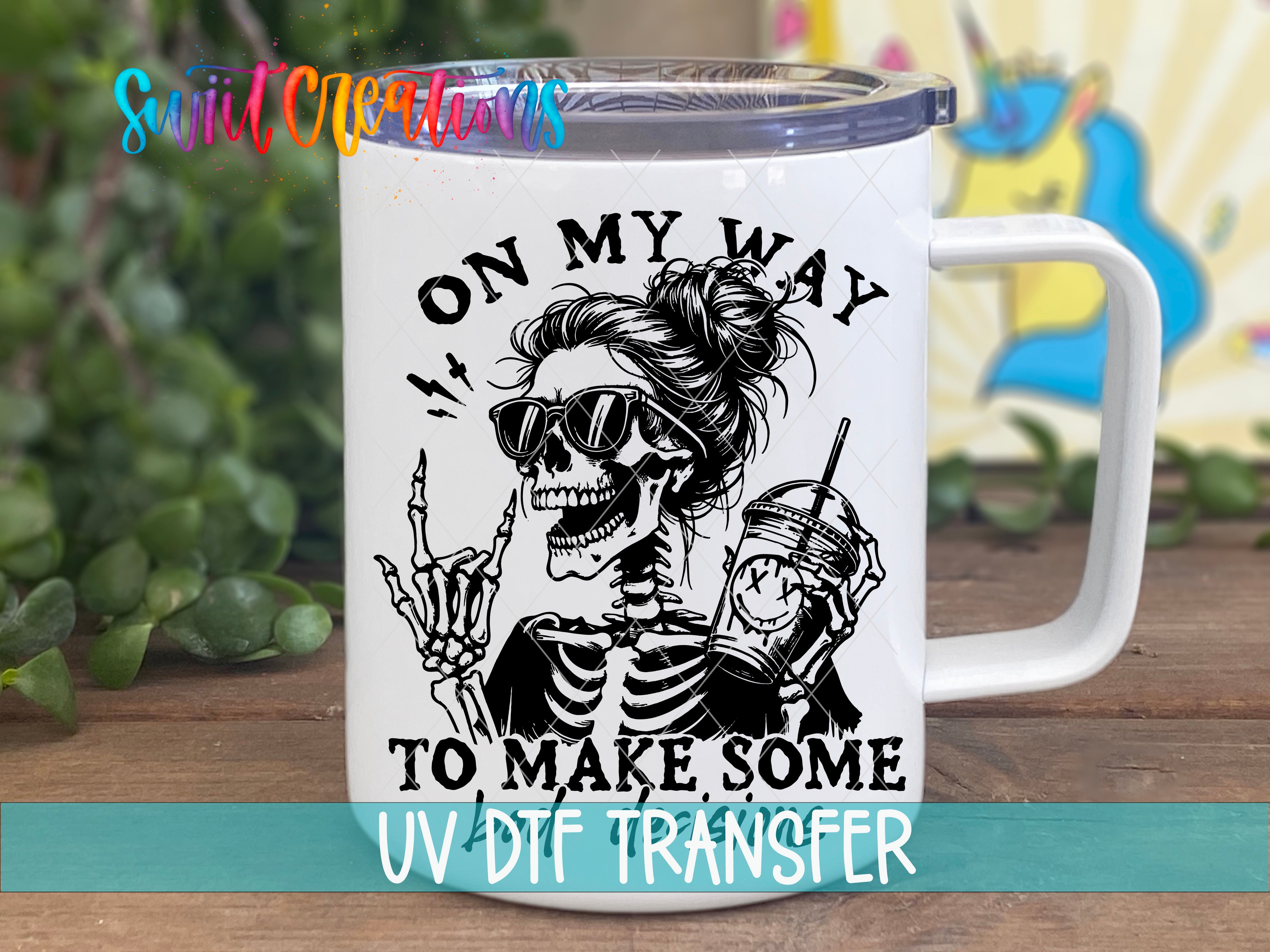 A white mug with a black and white illustration of a skeleton wearing sunglasses and holding a drink, along with the text "ON MY WAY TO MAKE SOME" printed on it.