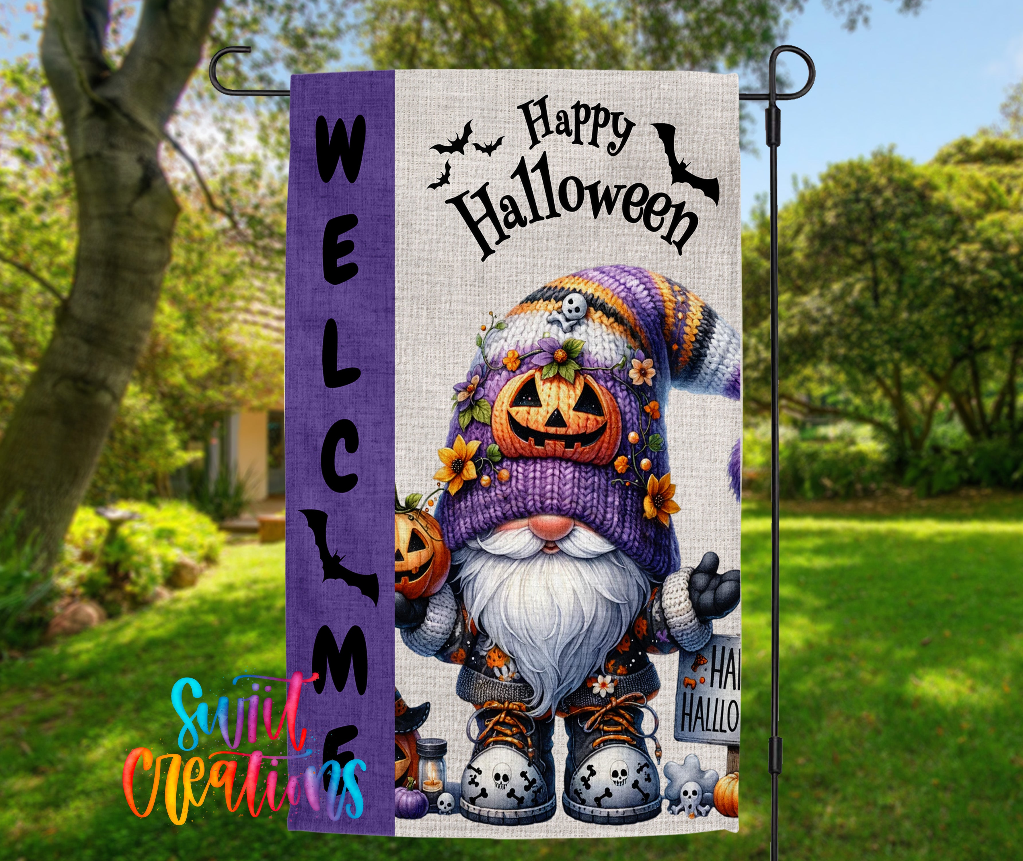 A Halloween-themed garden sign featuring a gnome wearing a purple hat with a pumpkin and flowers, holding a sign that says "Happy Halloween".