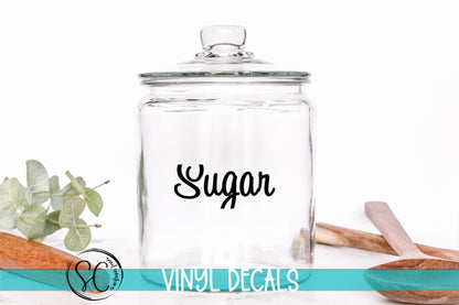 a glass jar with the word sugar on it