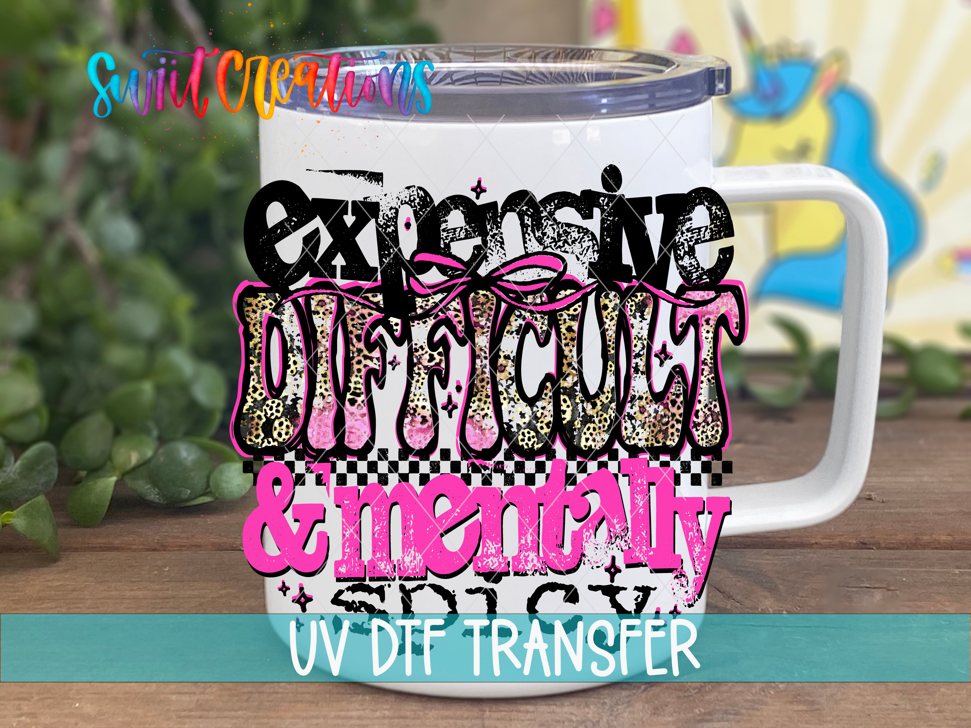 A white mug with a colorful, stylized design featuring the text "Expensive, Difficult & Mentally Spicy" in various fonts and colors.