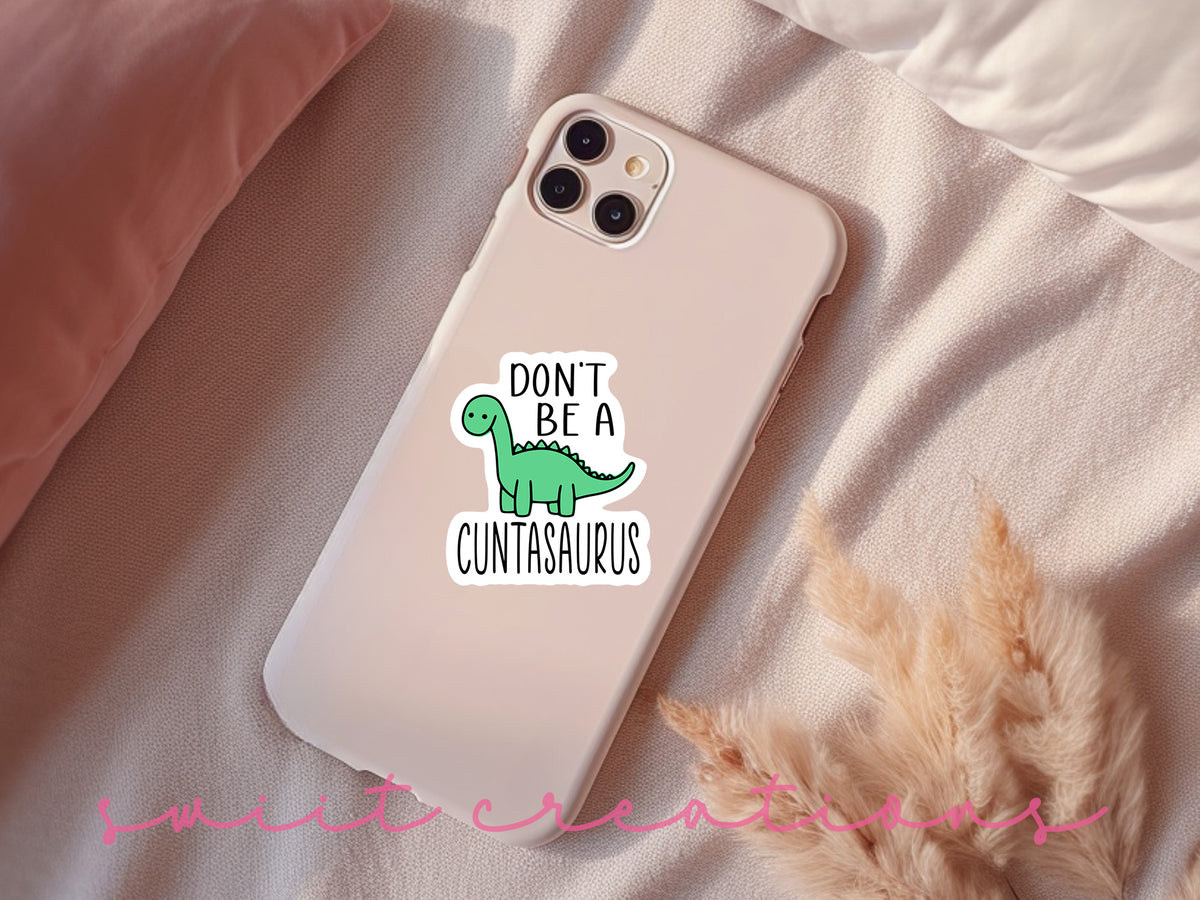 a phone case with a sticker of a dinosaur