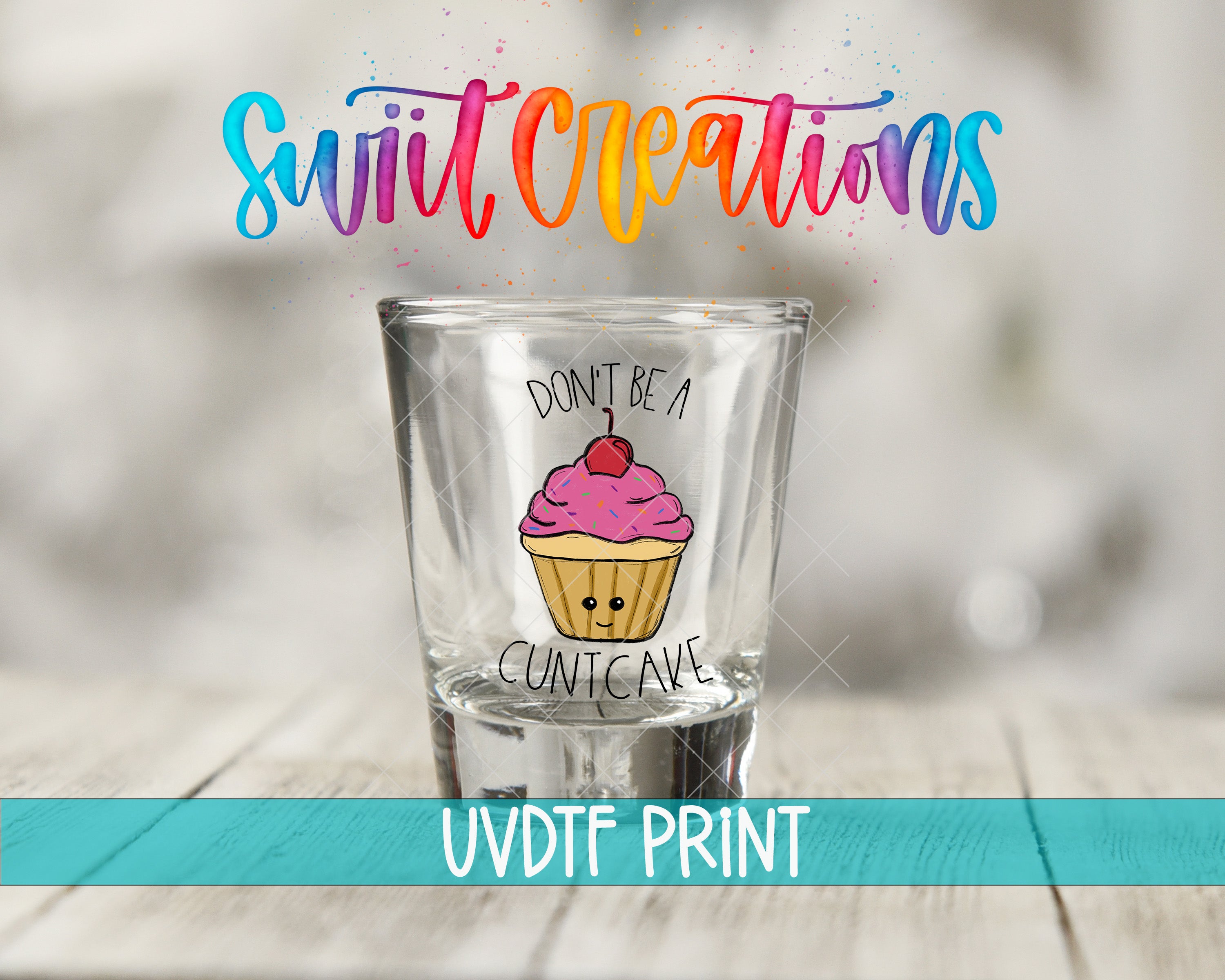 a shot glass with a cupcake design and a humorous message printed on it.