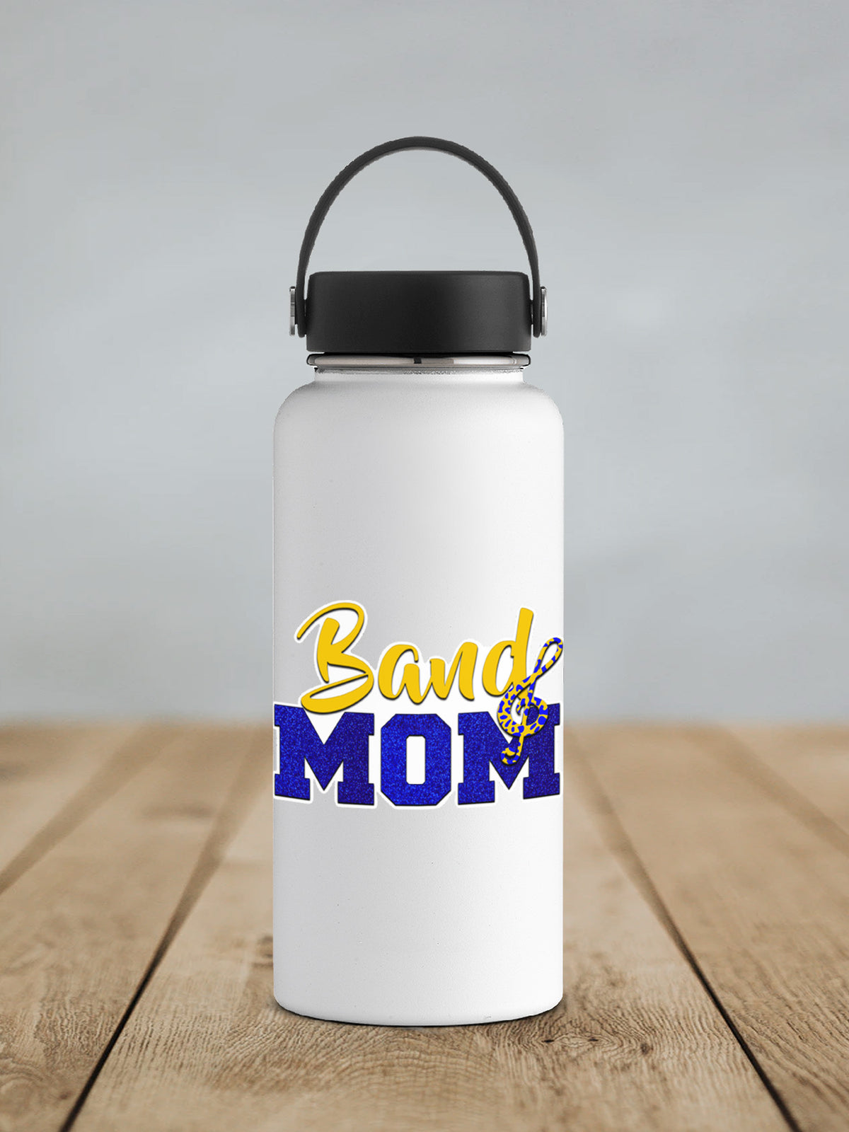 a white water bottle sitting on top of a wooden table