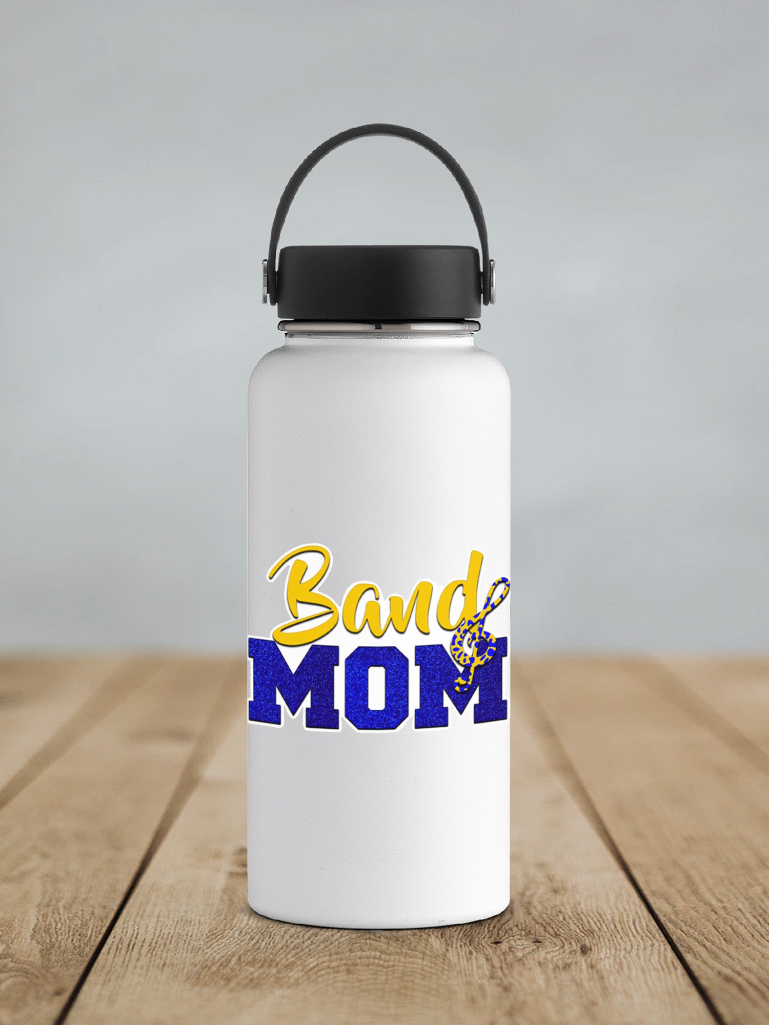 a white water bottle sitting on top of a wooden table
